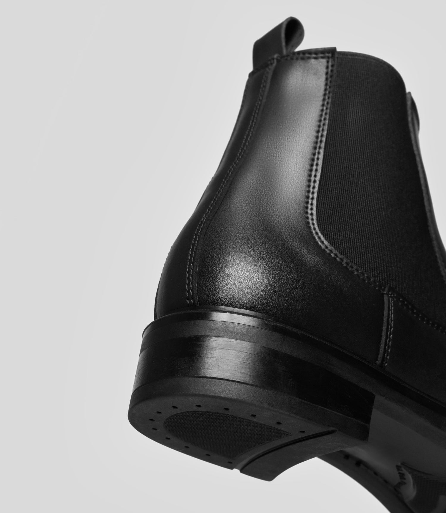 Black vegan Chelsea boot for women by Solari Milano, back view with heel detail