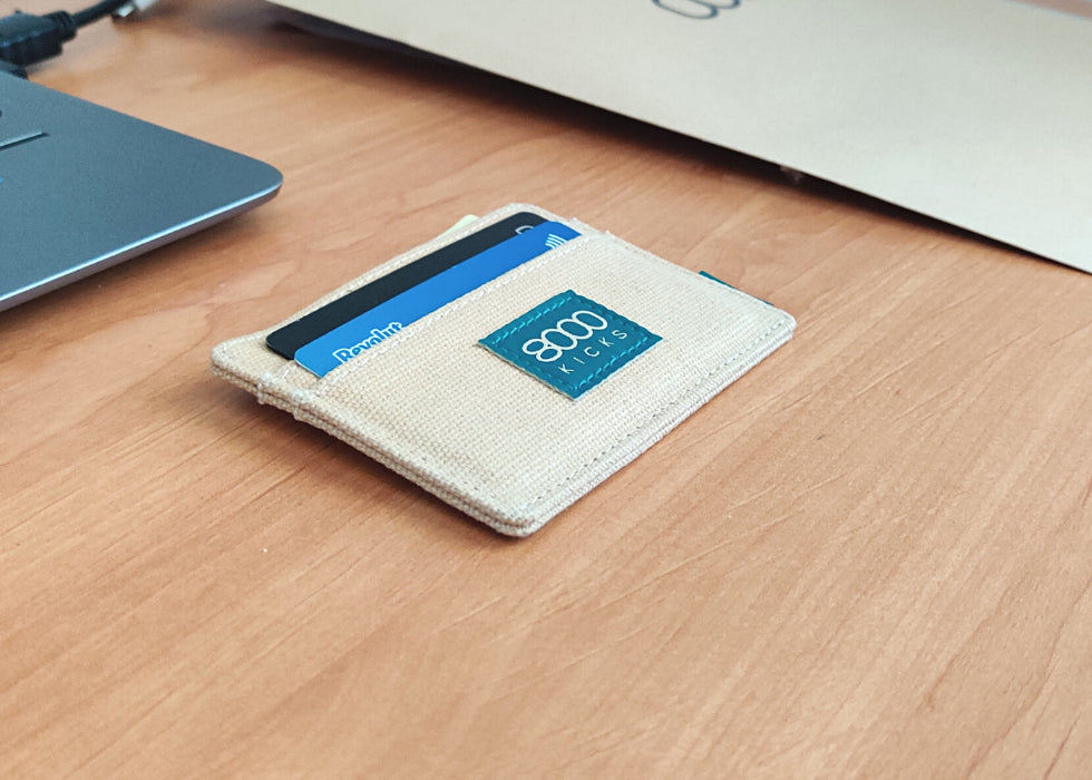 Beige skinny hemp wallet on a table
