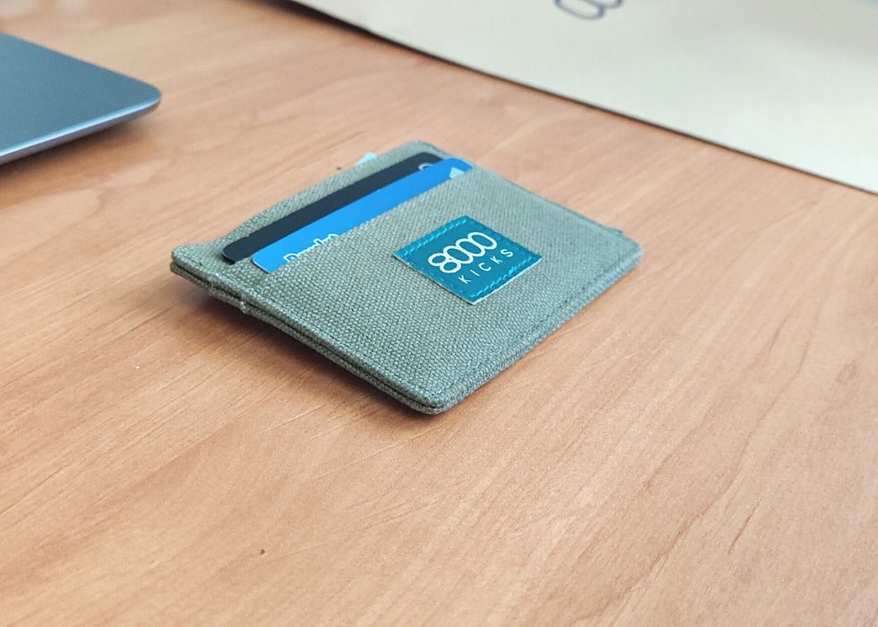 Green skinny hemp wallet on a table