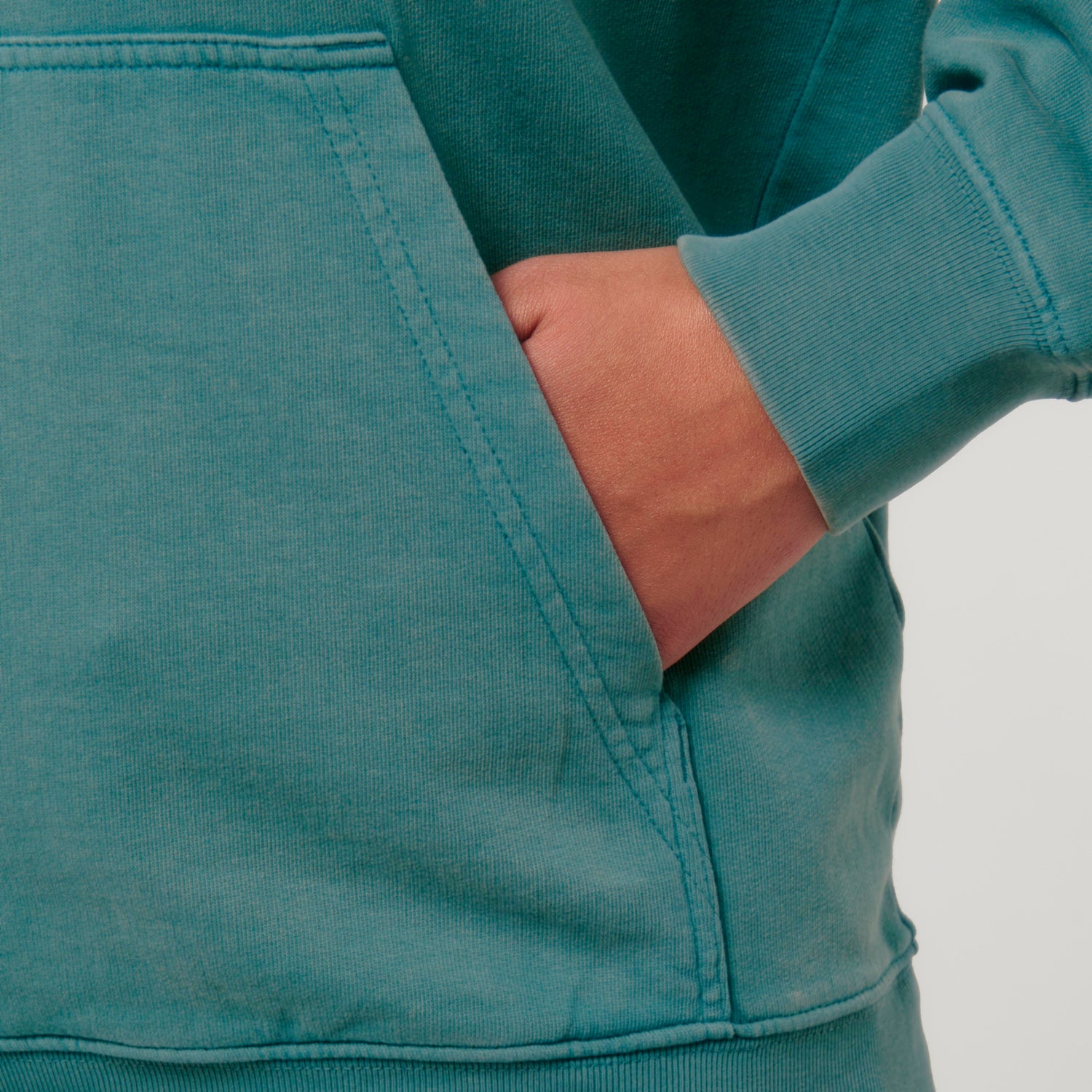 Close-up of relaxed fit hoodie in 100% GOTS-certified organic cotton, vintage washed style, eco-conscious design, 5 colors