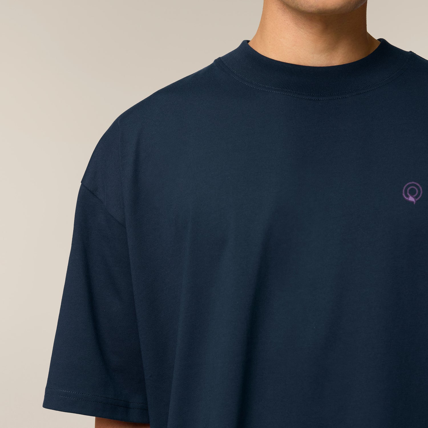 Close-Up, Male model wearing a french navy oversized t-shirt – sustainable and ethically made fashion by New World Guardians.