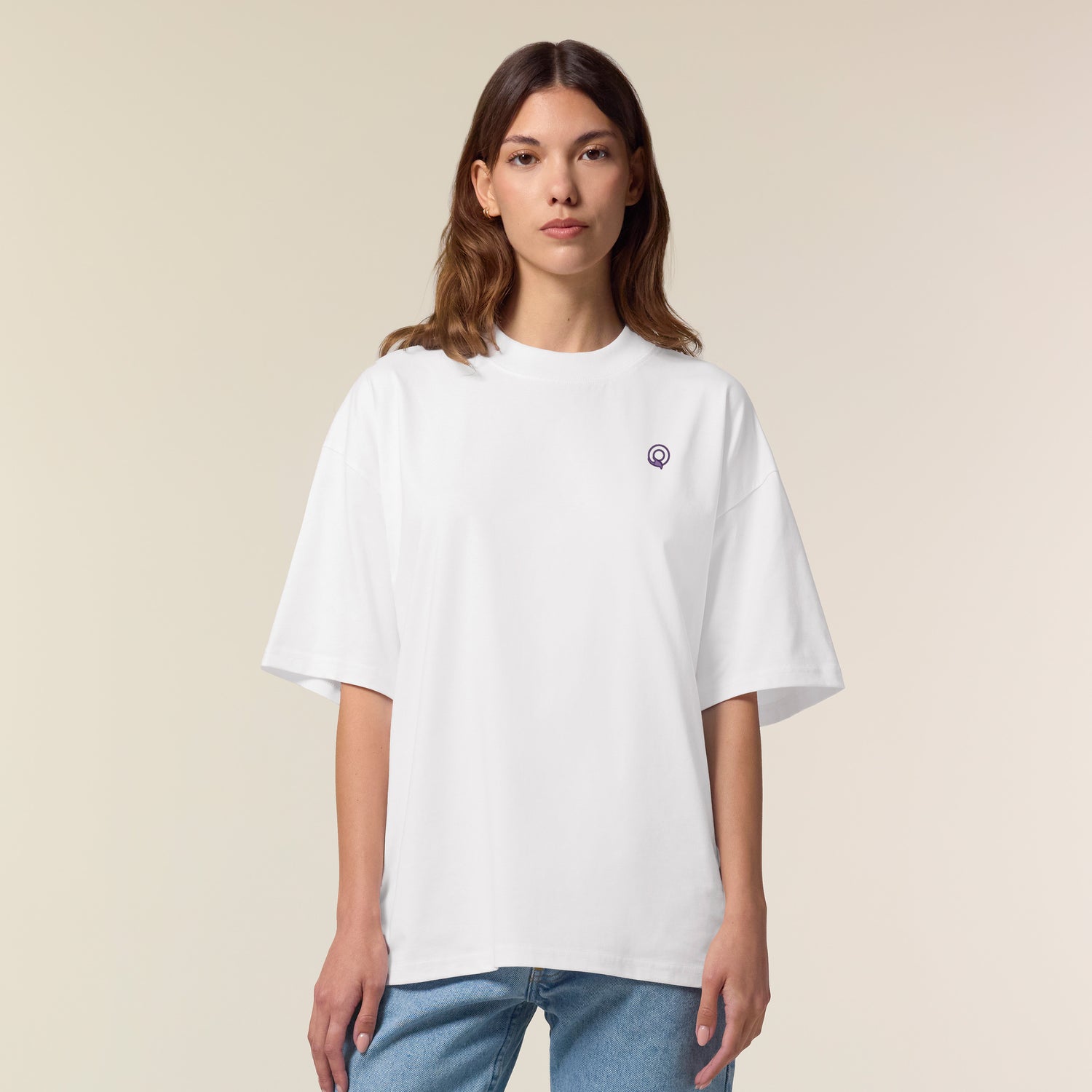 Female model wearing a white oversized unisex t-shirt – sustainable and ethically made fashion by New World Guardians.