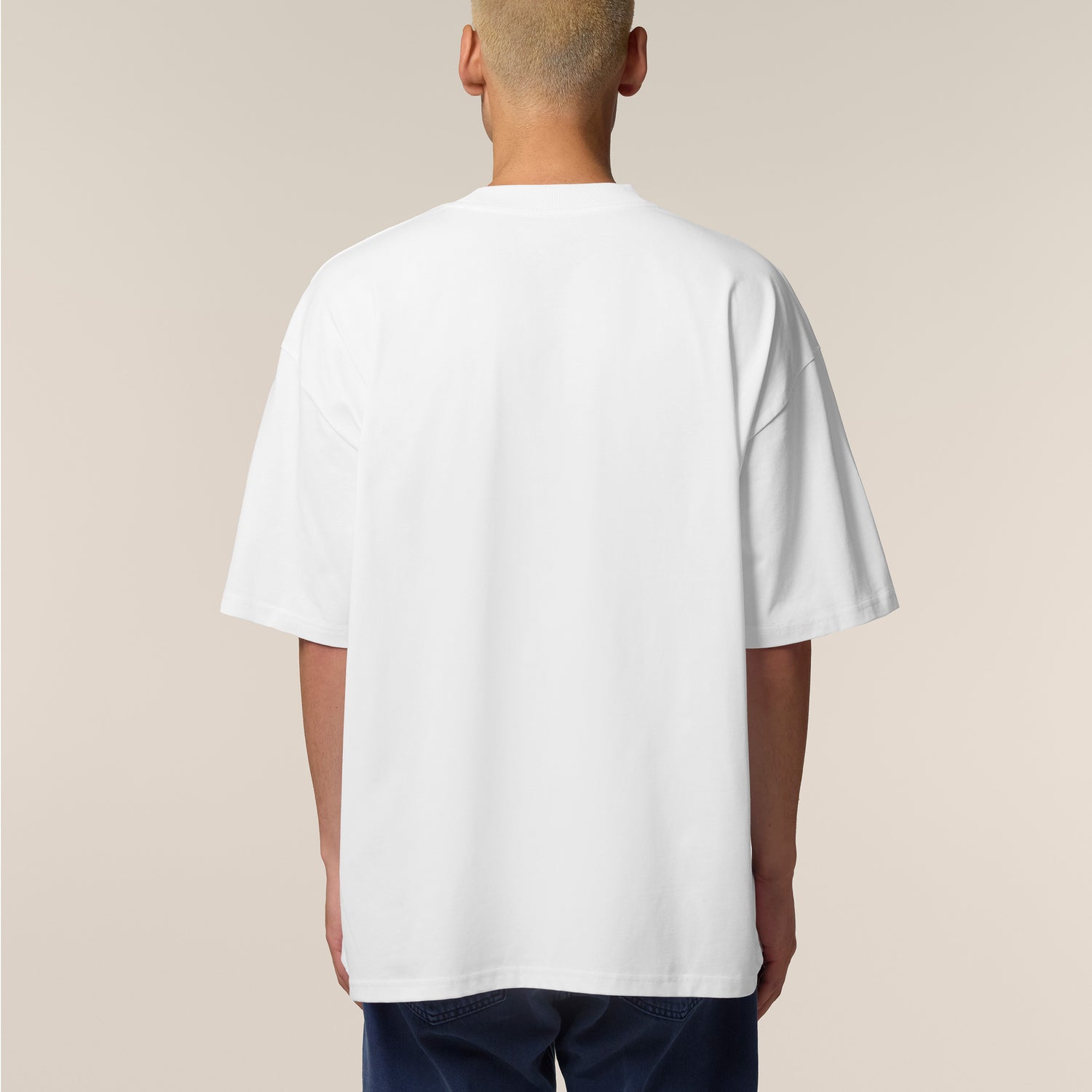 Back View, Male model wearing a white oversized t-shirt – sustainable and ethically made fashion by New World Guardians.