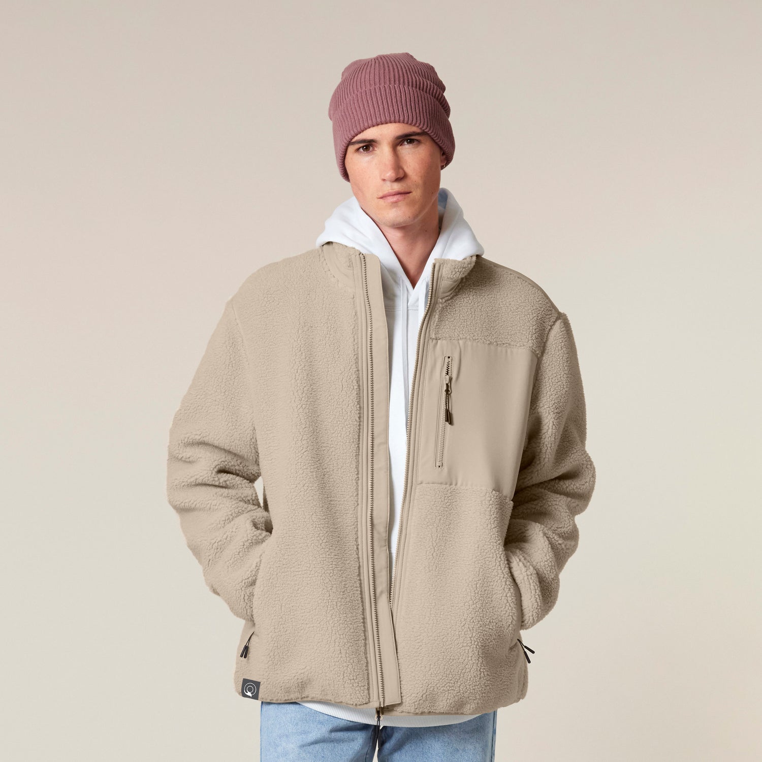 A person wearing a recycled polyester sherpa jacket with polar fleece interior for warmth and comfort, NEW WORLD GUARDIANS EARTH line