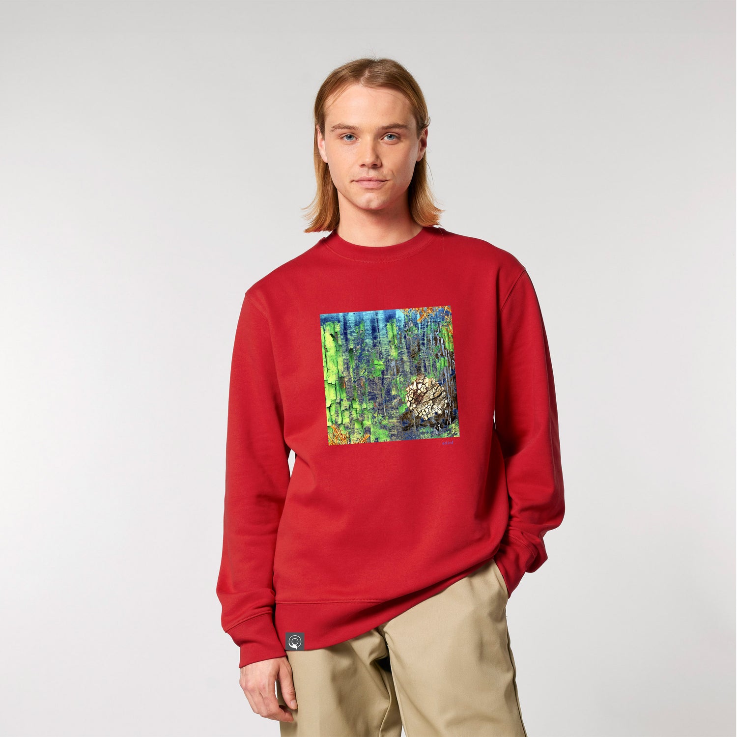 Male model with sustainable red sweater with art print, made from 100% organic cotton – sustainable and ethically made fashion by New World Guardians.