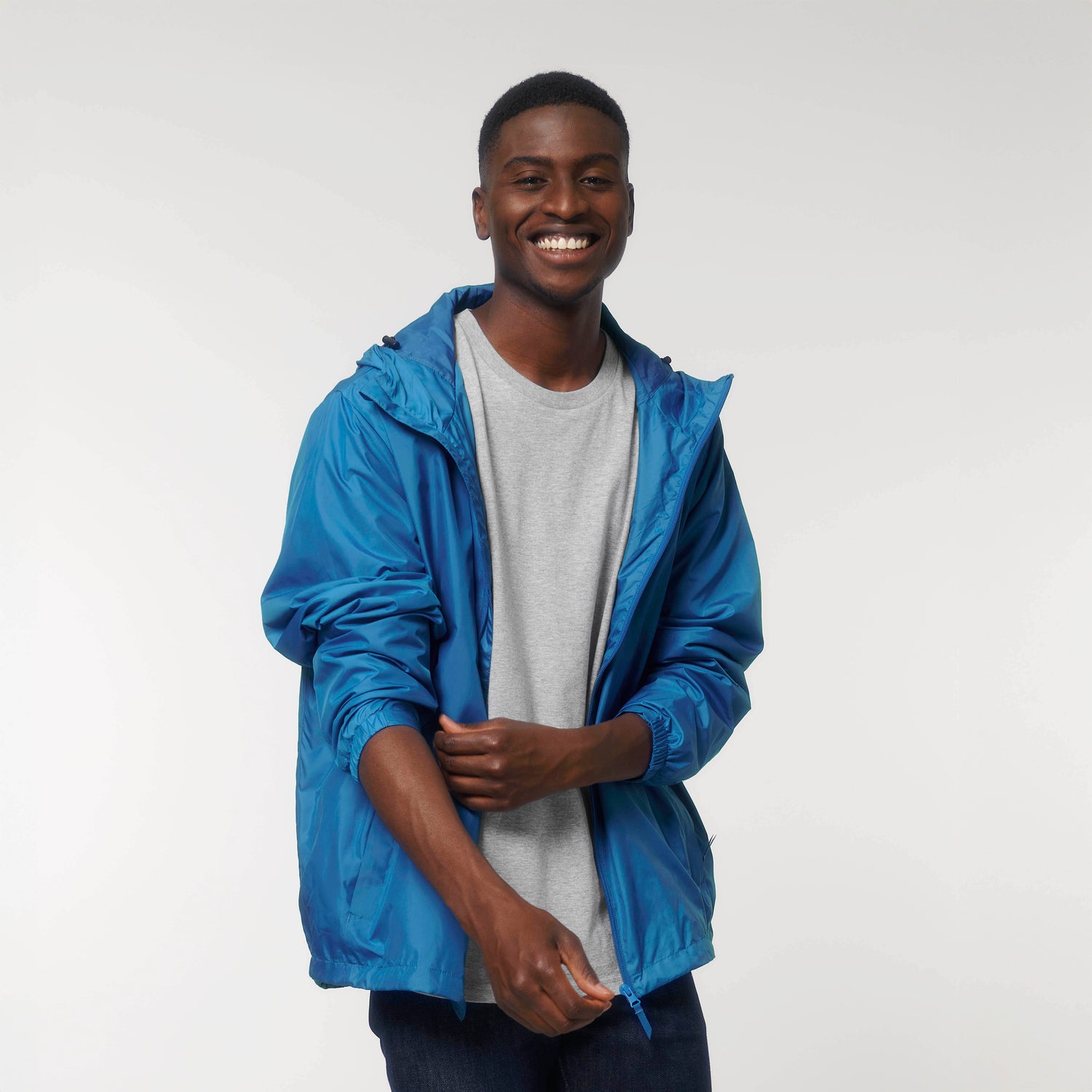Model wears GUARDIAN multi-function jacket by NEW WORLD GUARDIANS, versatile sustainable unisex outerwear, 10 color options
