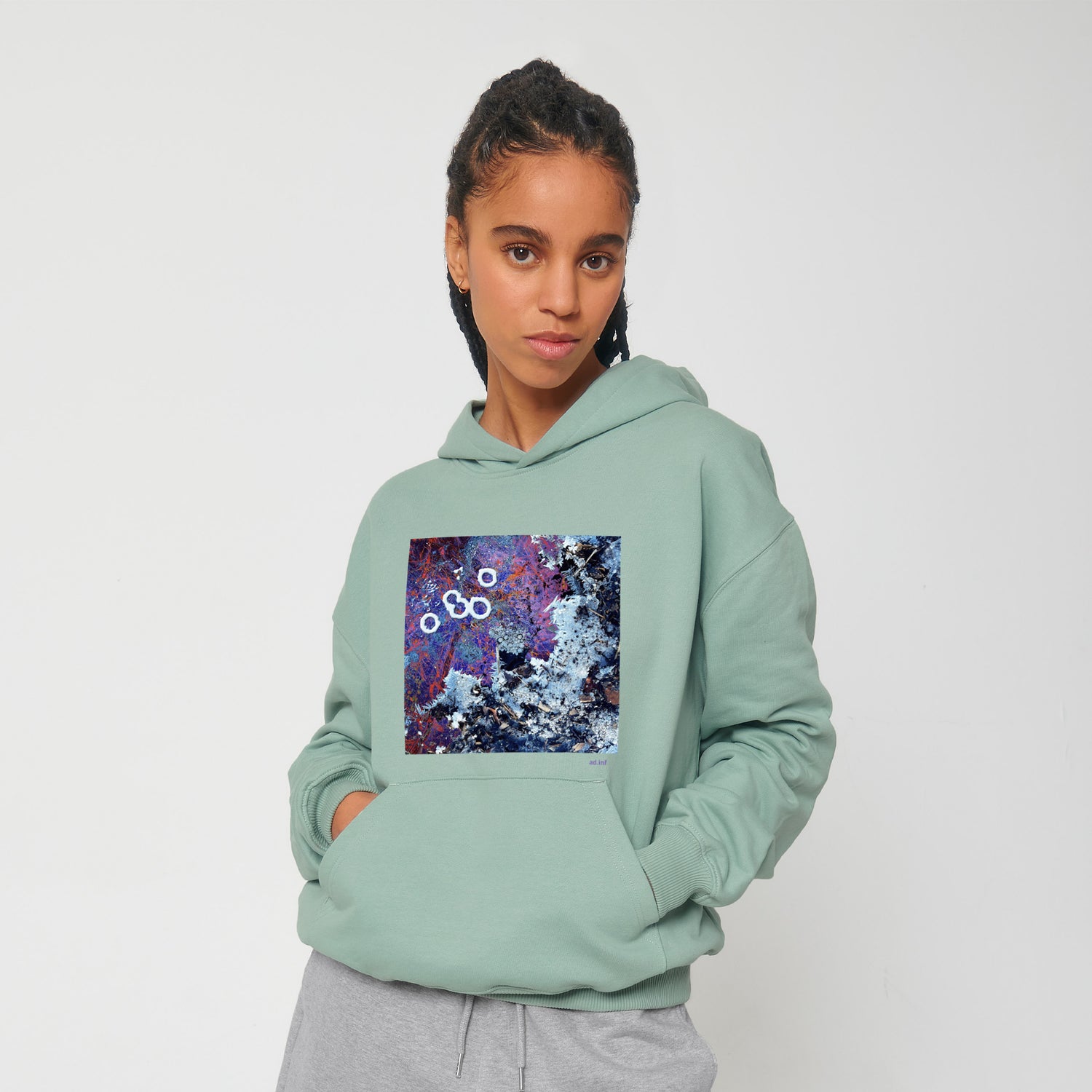 Front view of the aloe green hoodie with art print, made from 100% organic cotton – sustainable and ethically made fashion by New World Guardians.