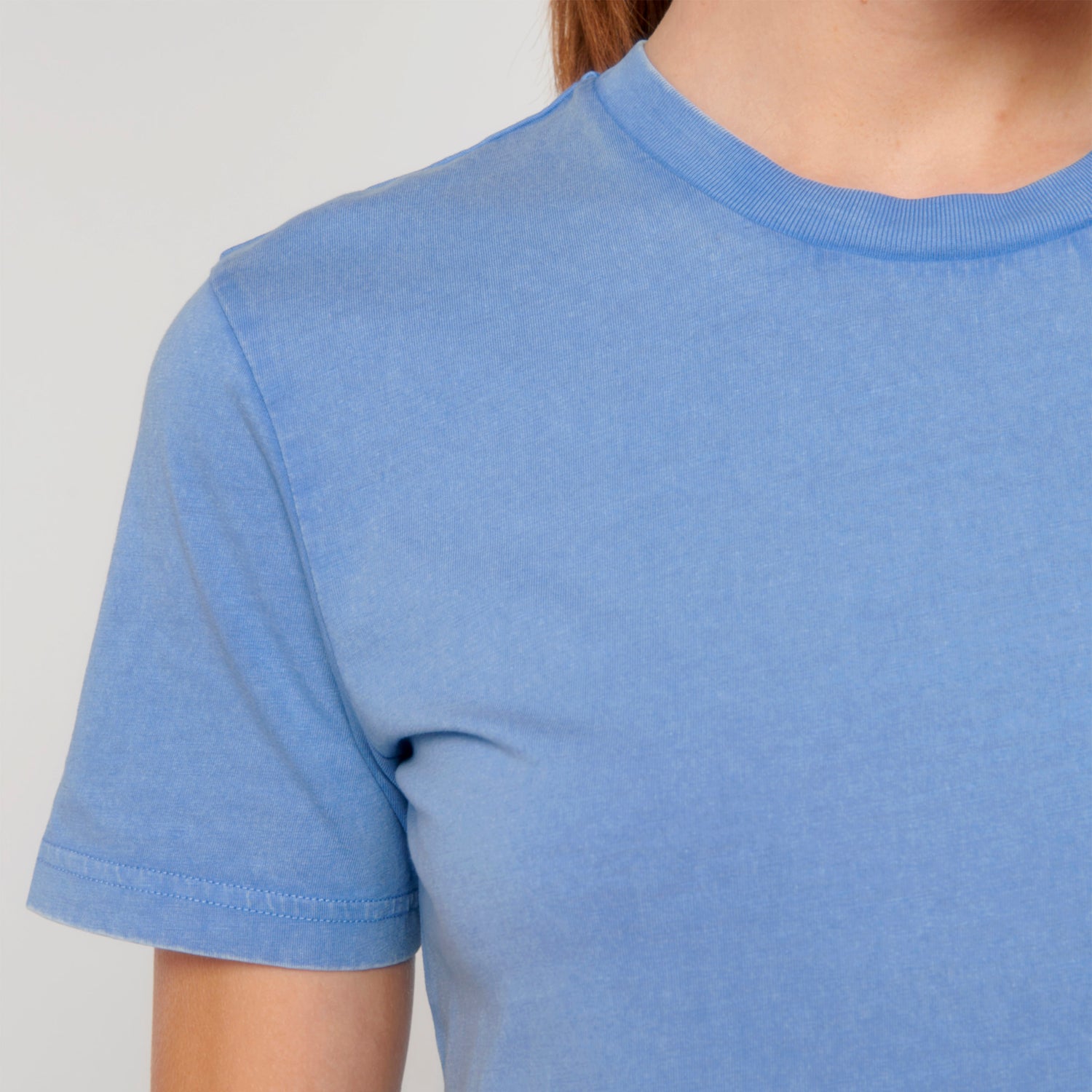 Models wearing vintage-style swimmer blue t-shirt made from sustainable organic cotton – eco-friendly fashion by New World Guardians