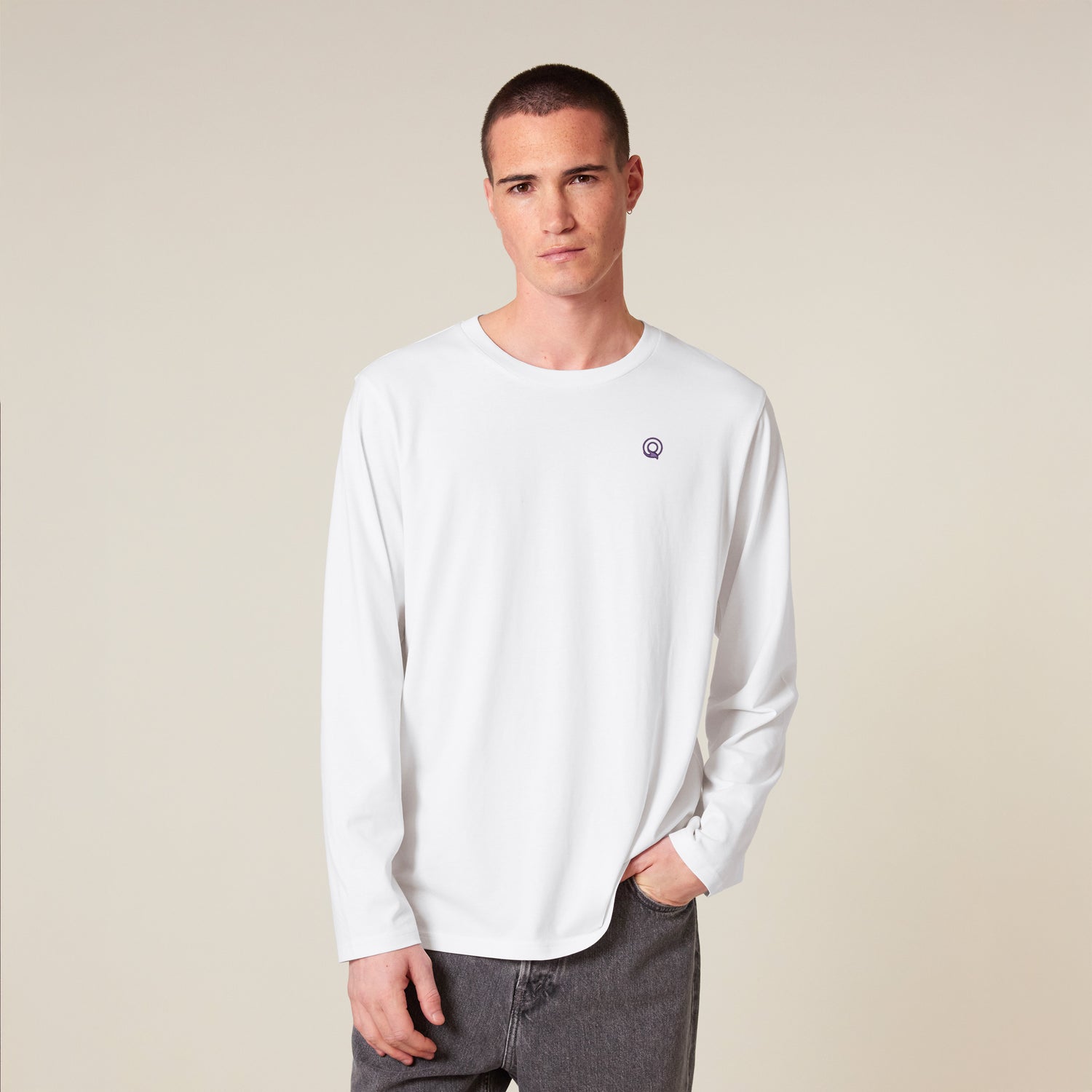 Male model wearing a white long sleeve shirt – sustainable and ethically made fashion by New World Guardians.