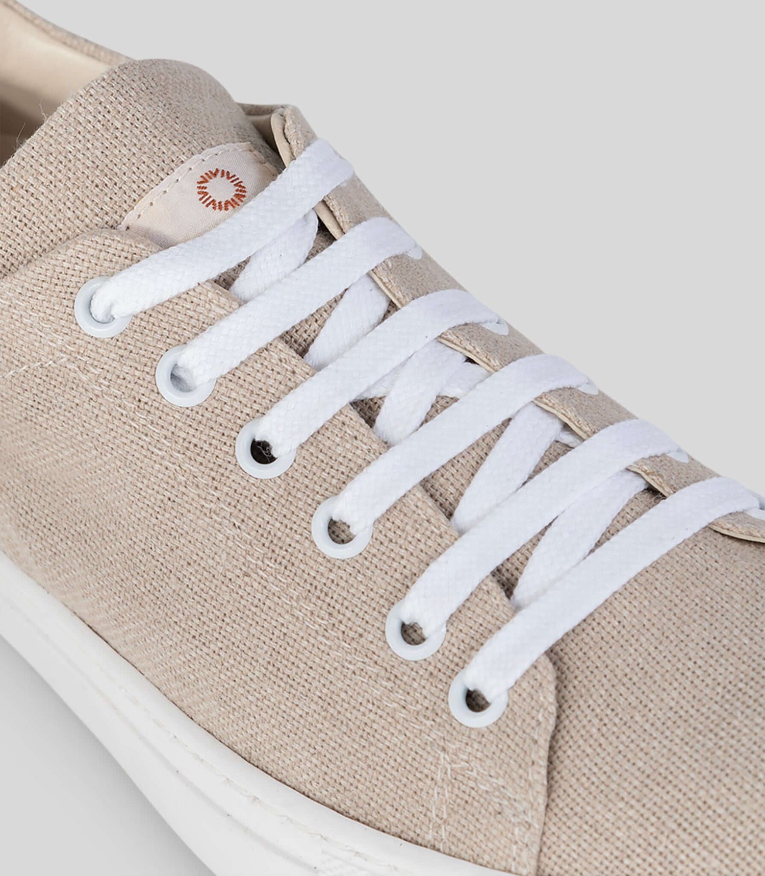 Close-up of Vegan Hemp Sneaker V1 featuring breathable hemp fabric and white laces.