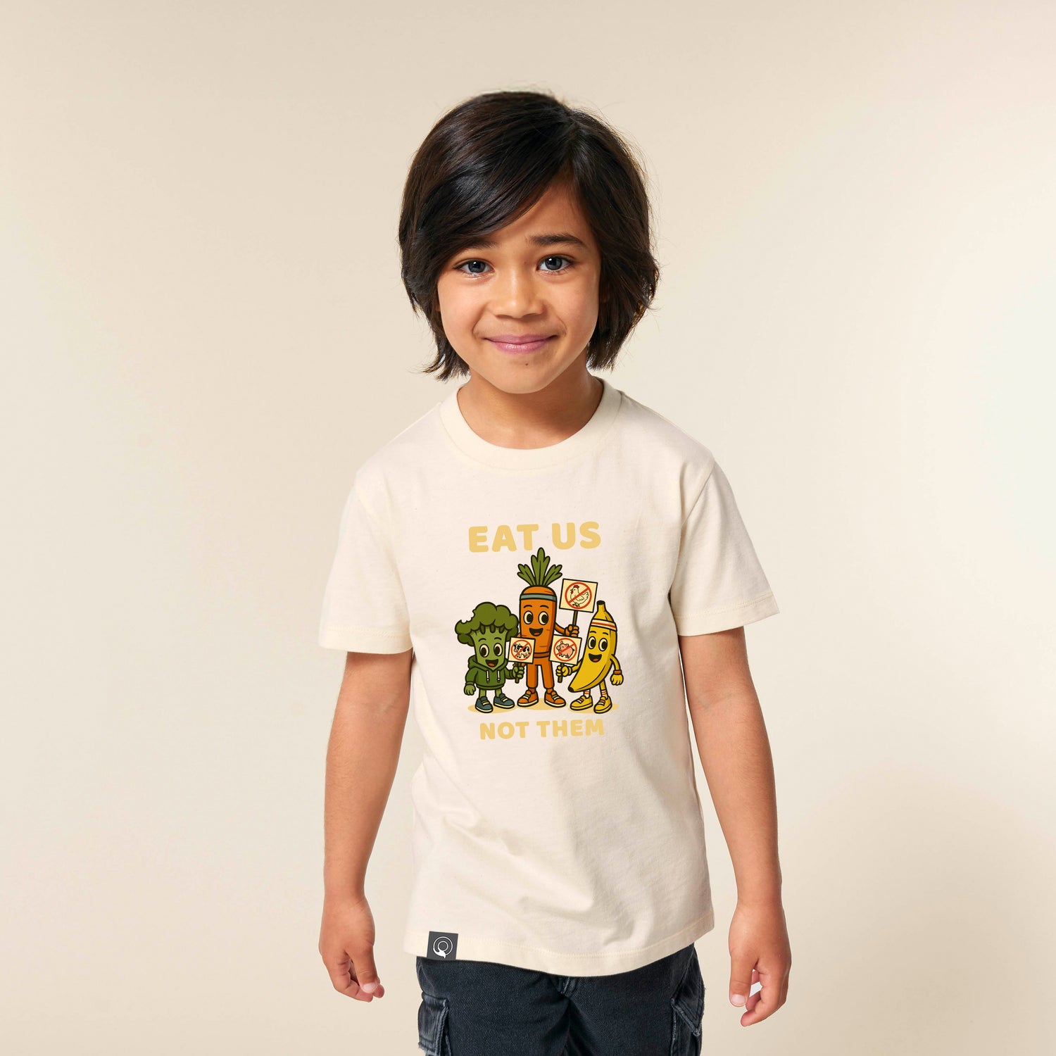 Child wearing beige organic cotton kids t-shirt with Full Squad vegan hero, sustainable fashion