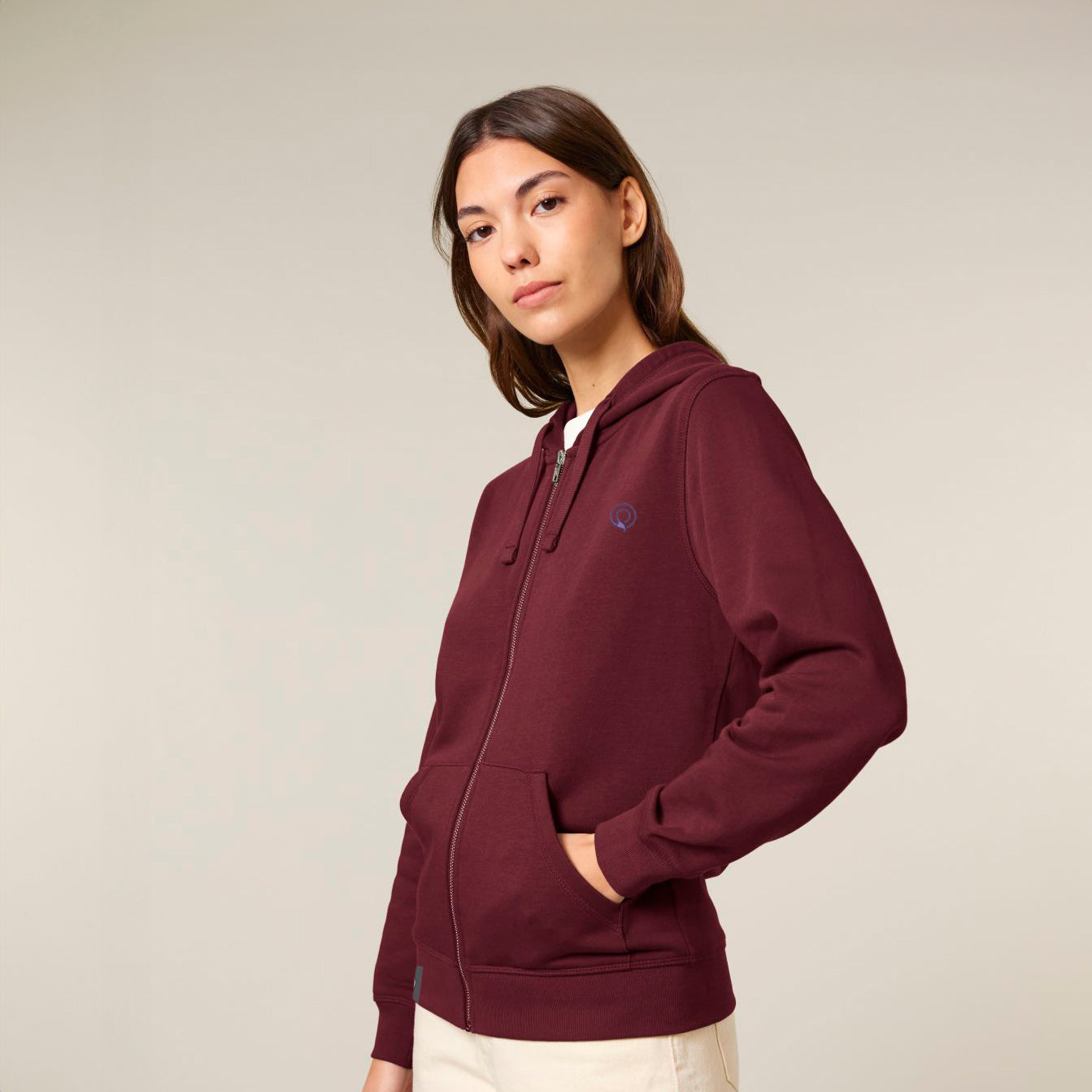 Model wears durable unisex hoodie in burgundy red, eco-conscious zip design by NEW WORLD GUARDIANS, 12 color options
