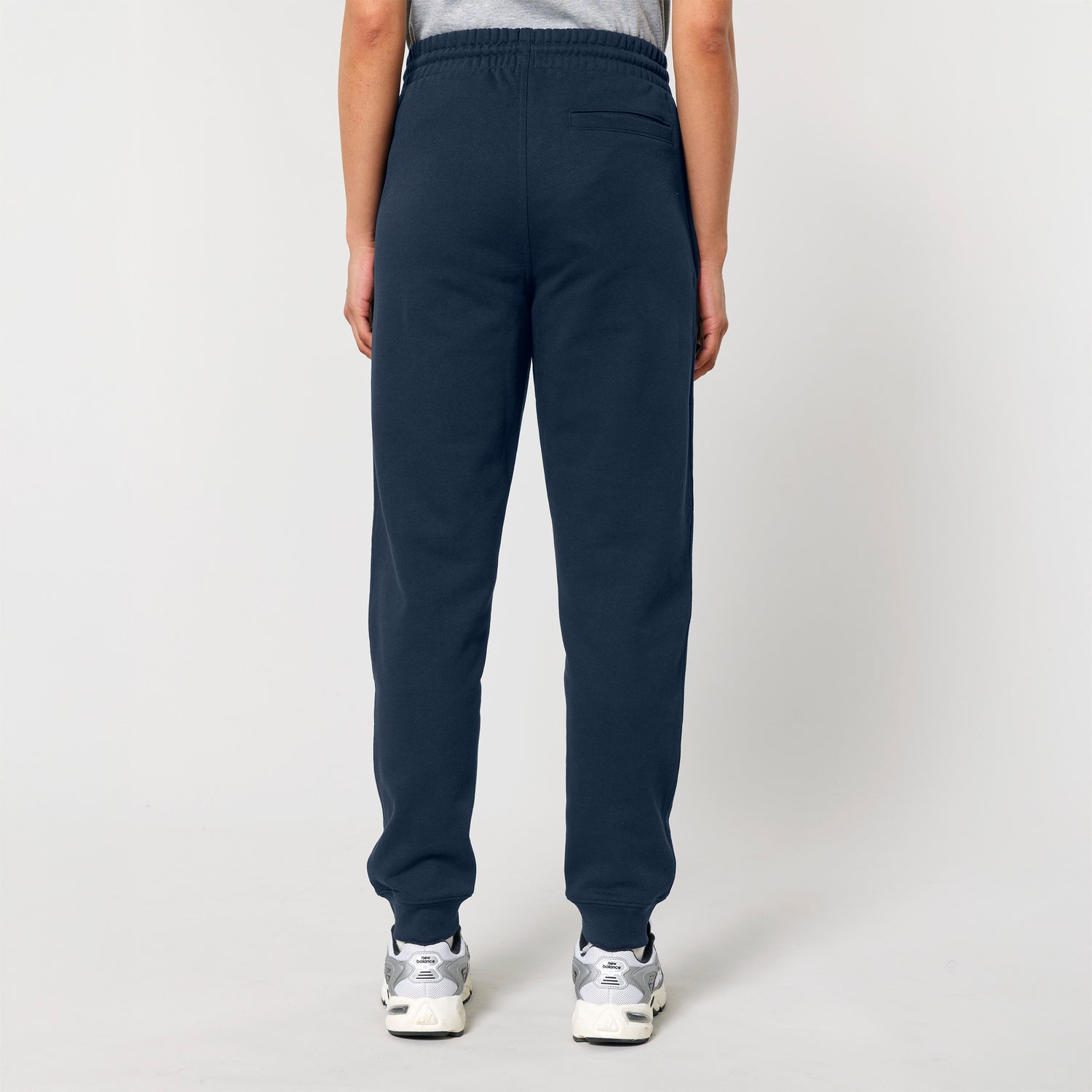 Back view from blue sustainable fashion joggers made from organic cotton with adjustable waistband and metal-tipped drawstrings