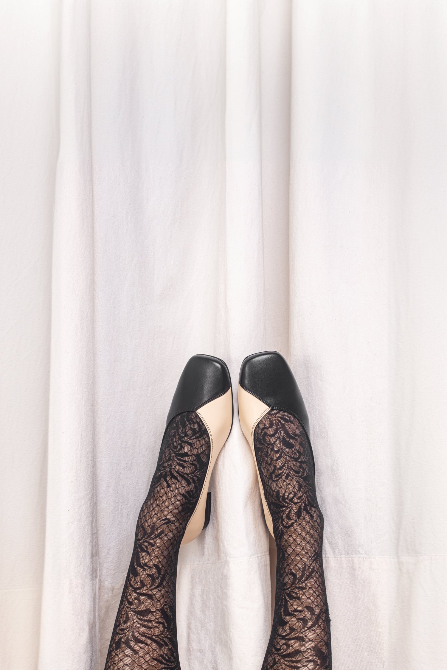 Wearing vegan flat shoes with elegant stockings | NAE Vegan Shoes
