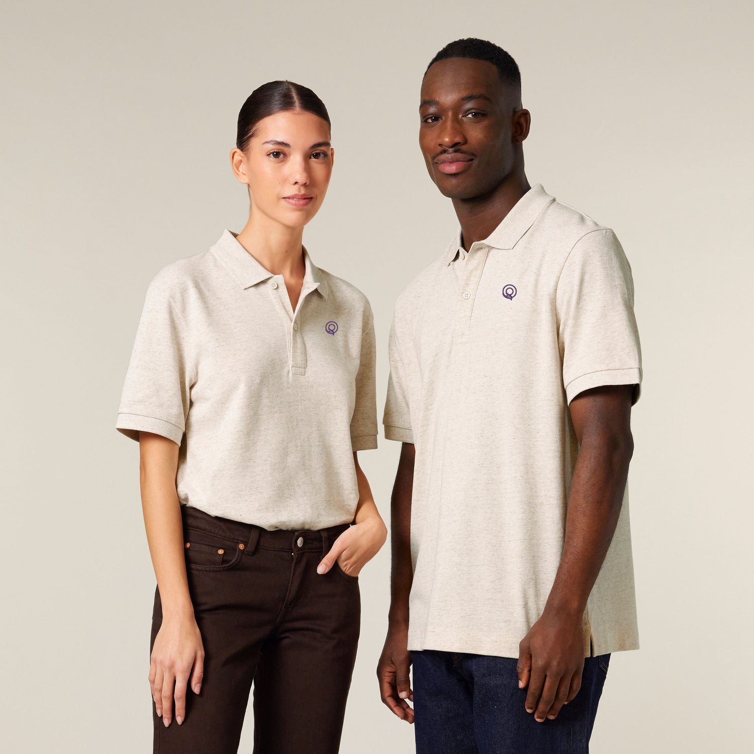 Two models wearing an eco heather unisex polo shirt – sustainable and ethically made fashion by New World Guardians.