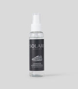 Shoe care - Clear spray bottle with black Solari Milano label on a light gray background