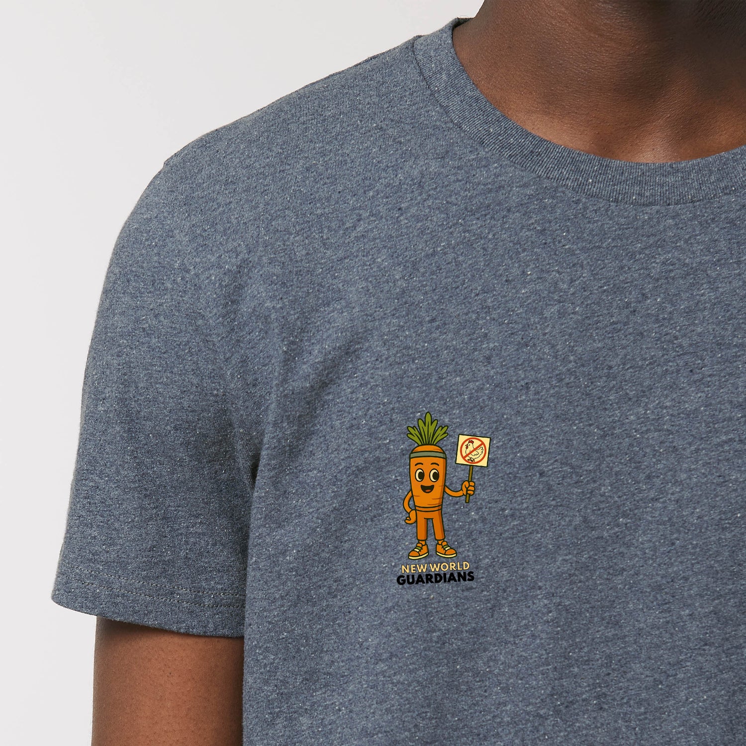 Close-up of male model wearing a navy blue NEW WORLD GUARDIANS unisex vegan T-shirt featuring Crunch the carrot in a comic-style front print and the full Roots for Our Future veggie squad with “Eat Us Not Them” slogan on the back. Made from organic and recycled cotton. Conscious vegan fashion and sustainable streetwear with bold energy.