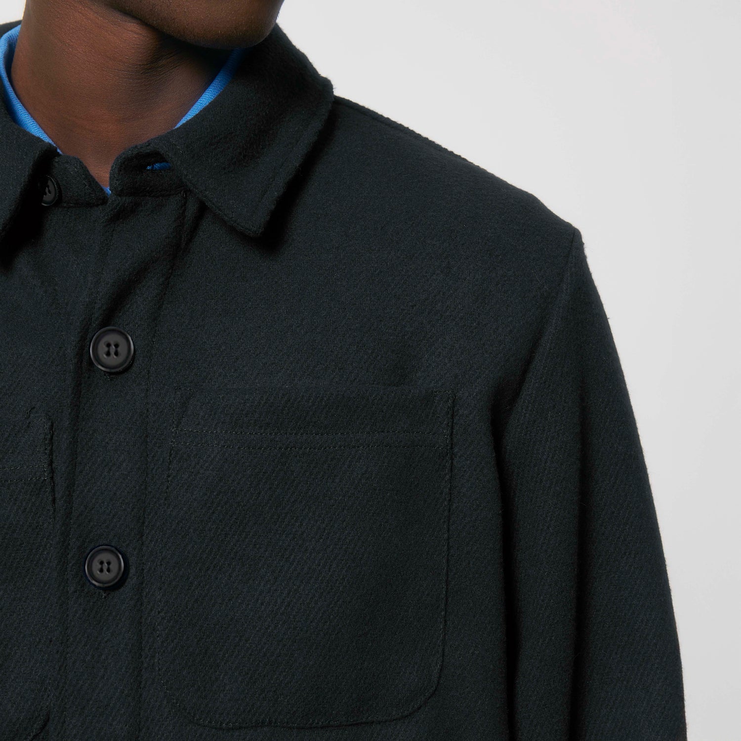 Close-Up of sustainable shirt jacket with button-up front and relaxed fit, NEW WORLD GUARDIANS Eco Pioneer design, 3 colors