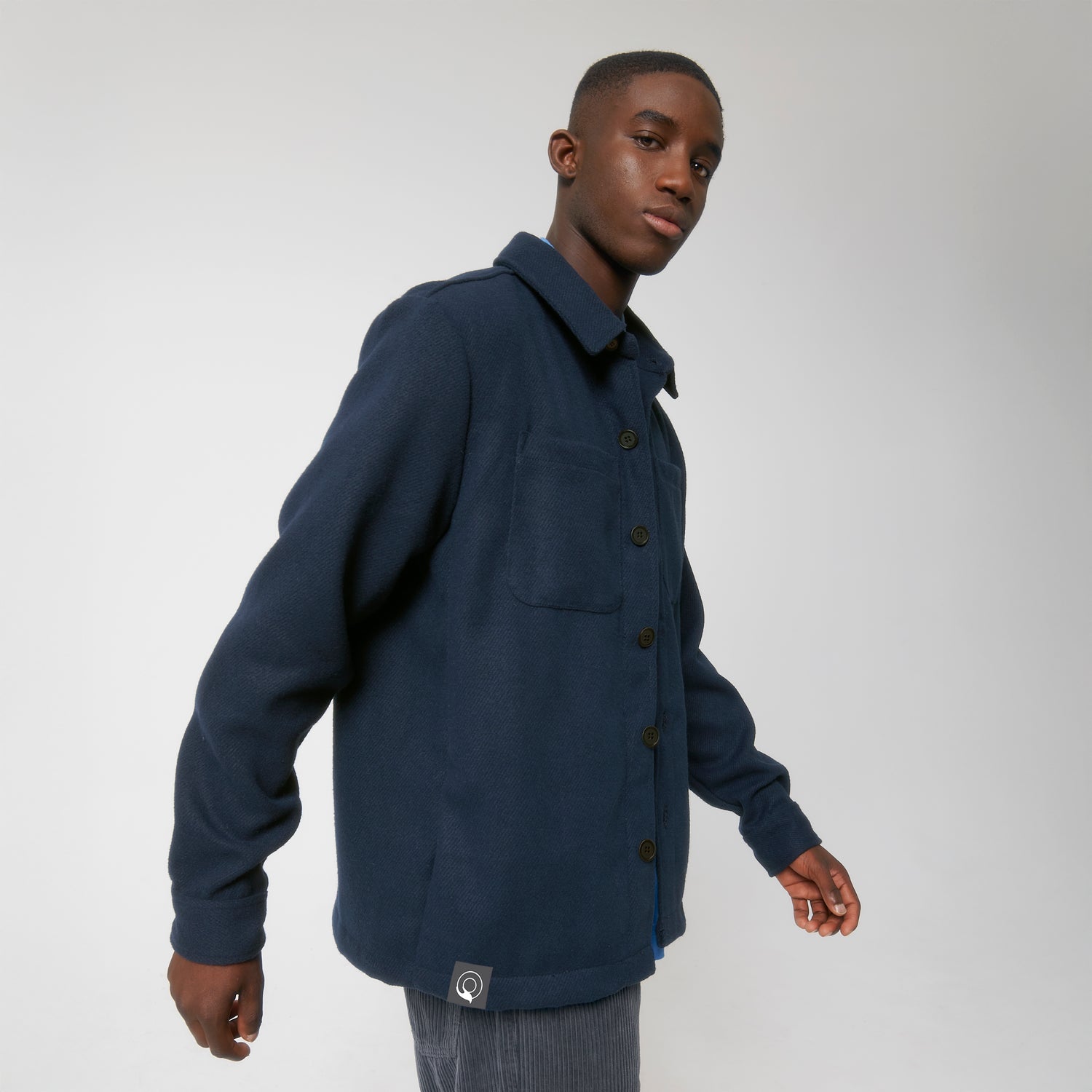 Male model wears NEW WORLD GUARDIANS Eco Pioneer shirt jacket in 100% recycled polyester, sustainable unisex overshirt, 3 colors