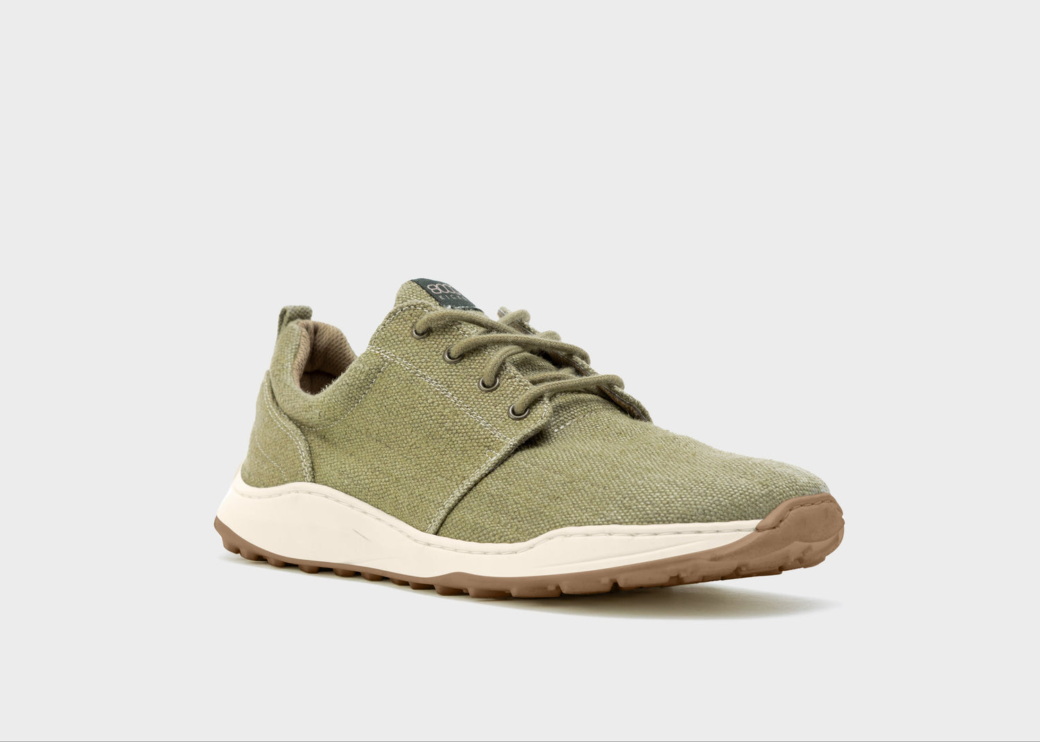 Green sneaker on a light gray background