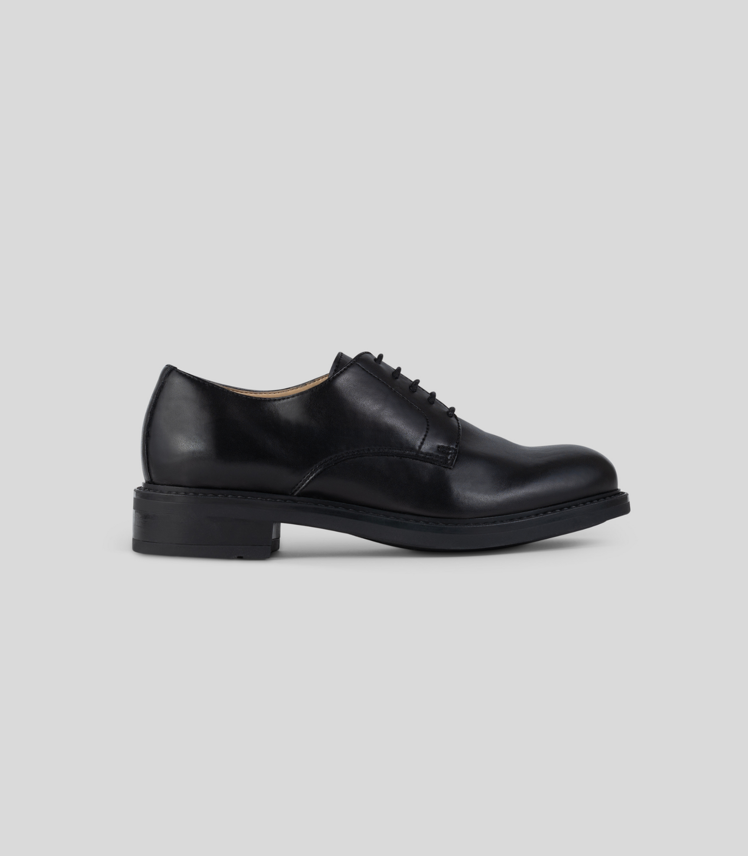 Vegan Derby - Woman black shoe side view showcasing Blake Construction detail.