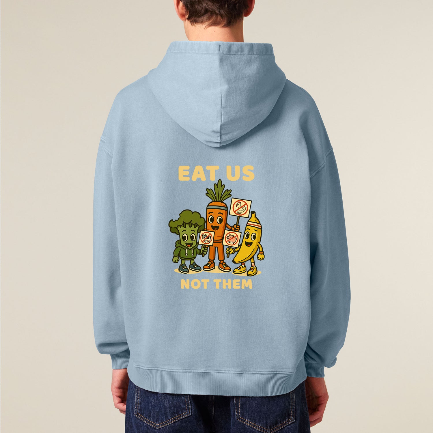 Male model wearing a blue NEW WORLD GUARDIANS unisex vegan hoodie showing the full Roots for Our Future veggie squad in a bold comic-style back print. Made from 100% organic cotton. Sustainable streetwear and expressive vegan fashion for everyday heroes.