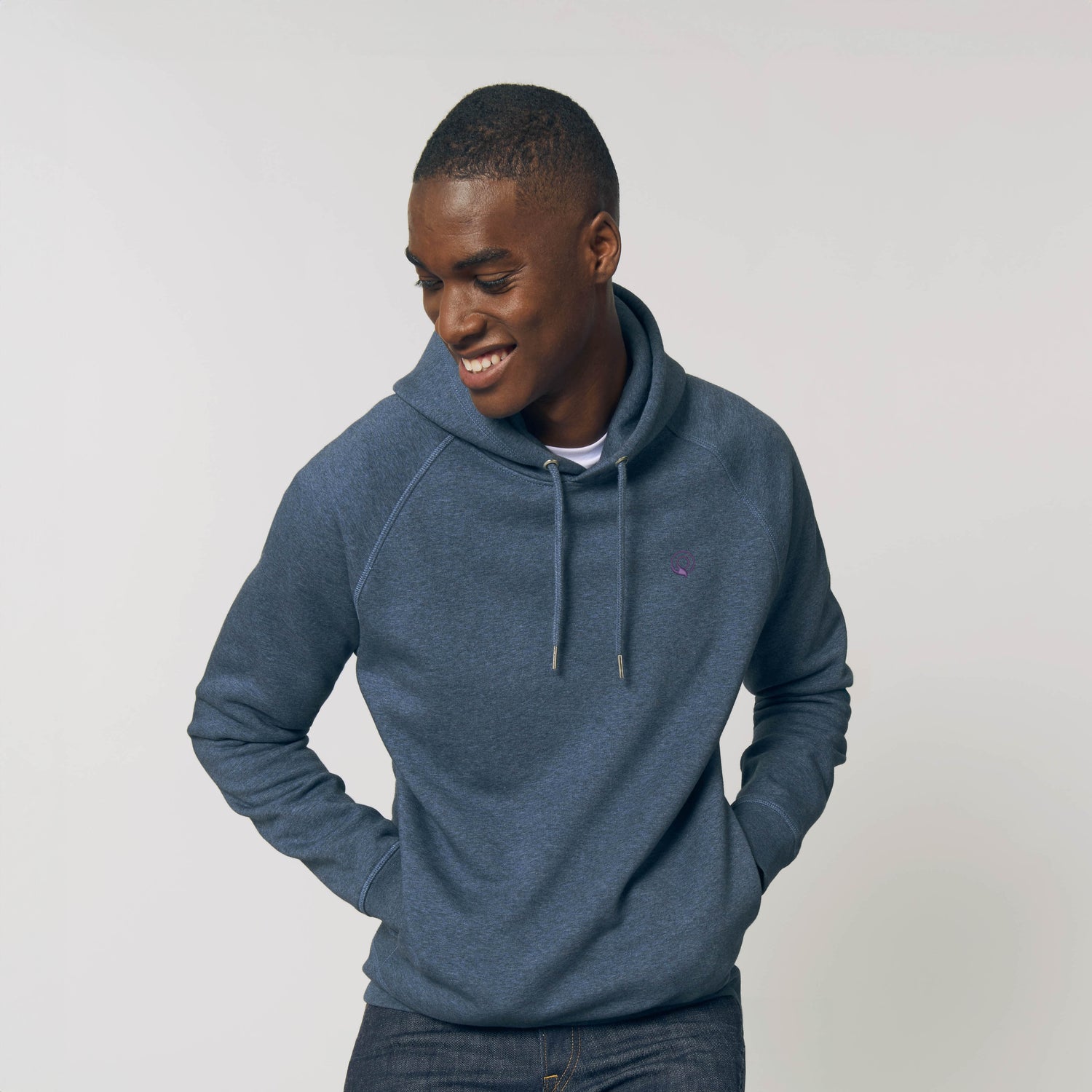 Model wears eco-friendly unisex hoodie with raglan sleeves, lined hood and angled side pockets, 11 color options