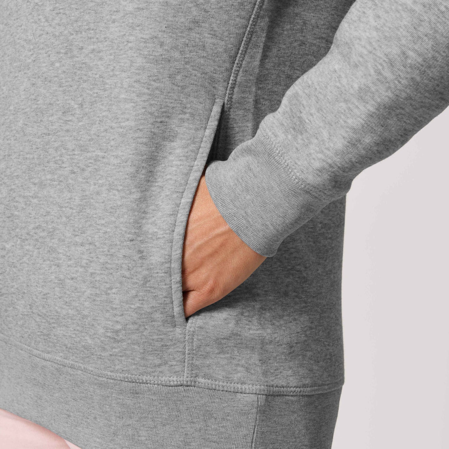 Close-Up of sustainable hoodie with flatlock stitching and premium metal details, NEW WORLD GUARDIANS GUARDIAN design