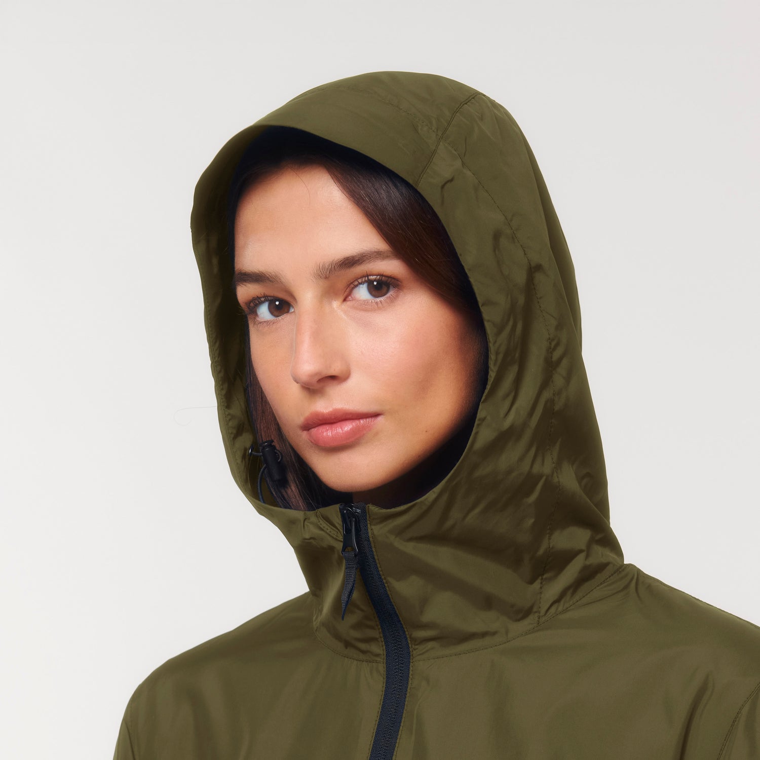 Close-Up of Guardian anorak with curved back hem, reflective details and drawstring adjustments, unisex sustainable jacket