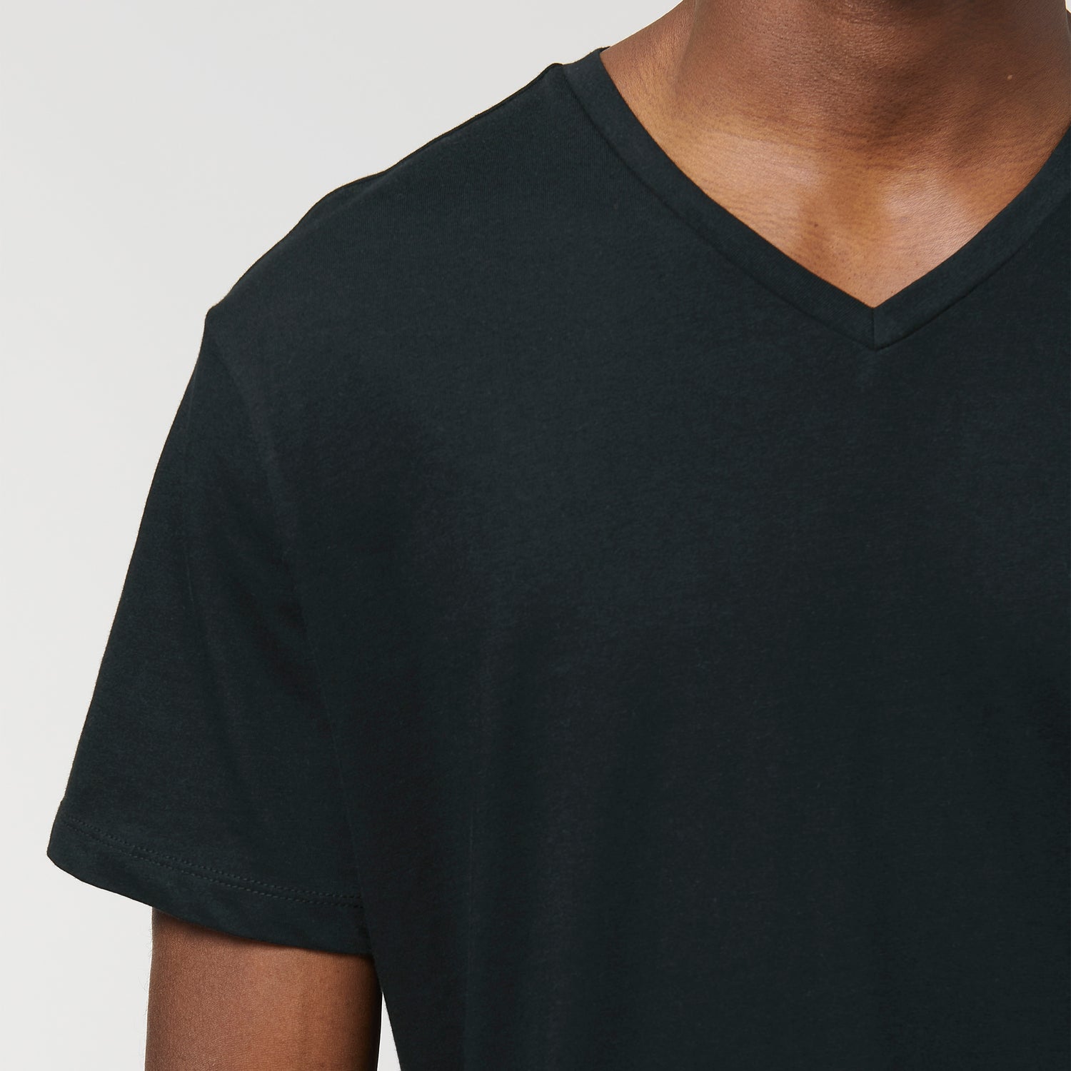 Black sustainable men’s organic cotton v-neck t-shirt with modern tailored fit, NEW WORLD GUARDIANS design, 3 colors