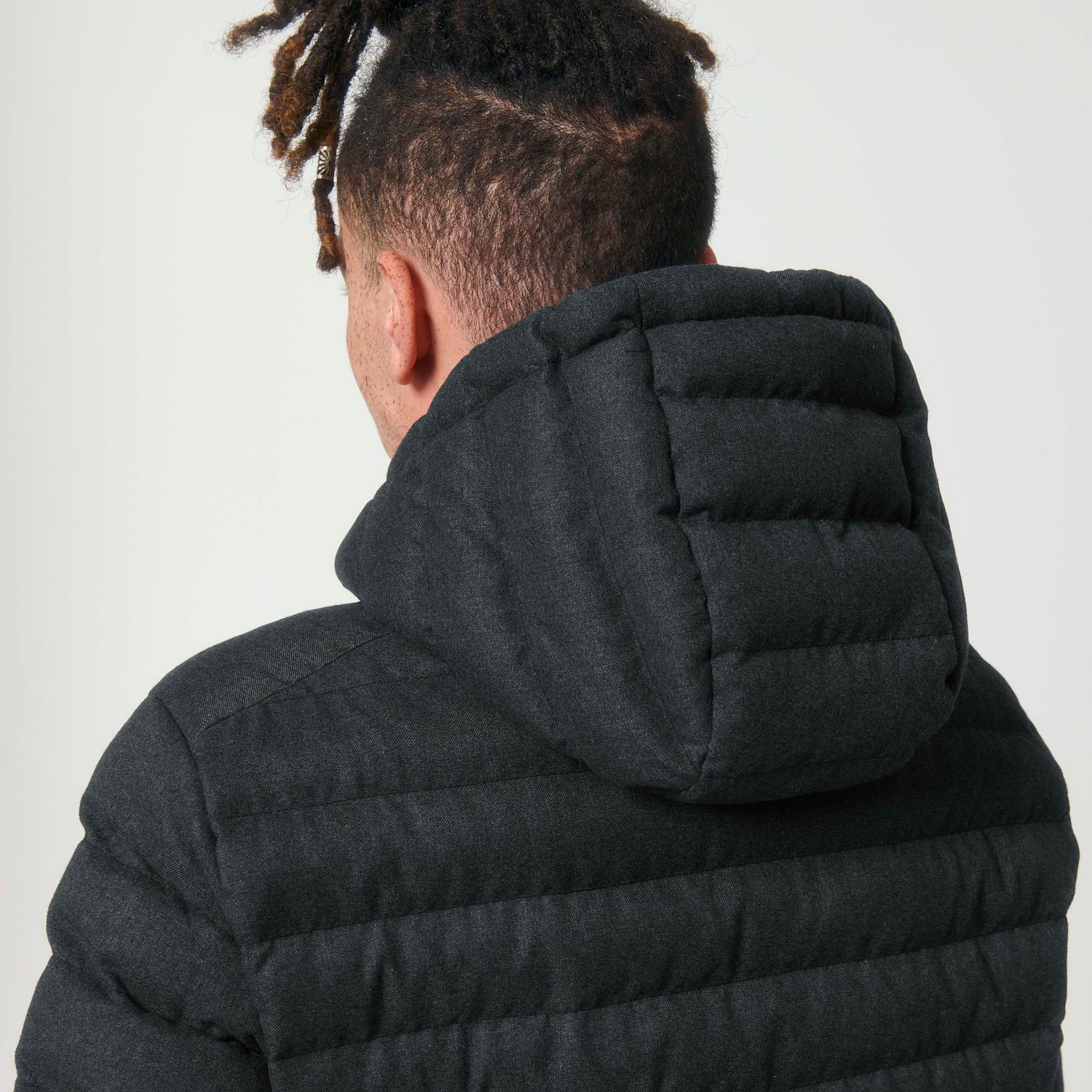 Close-Up of wool-look men’s padded jacket with high collar and zippered pockets, NEW WORLD GUARDIANS EARTH design