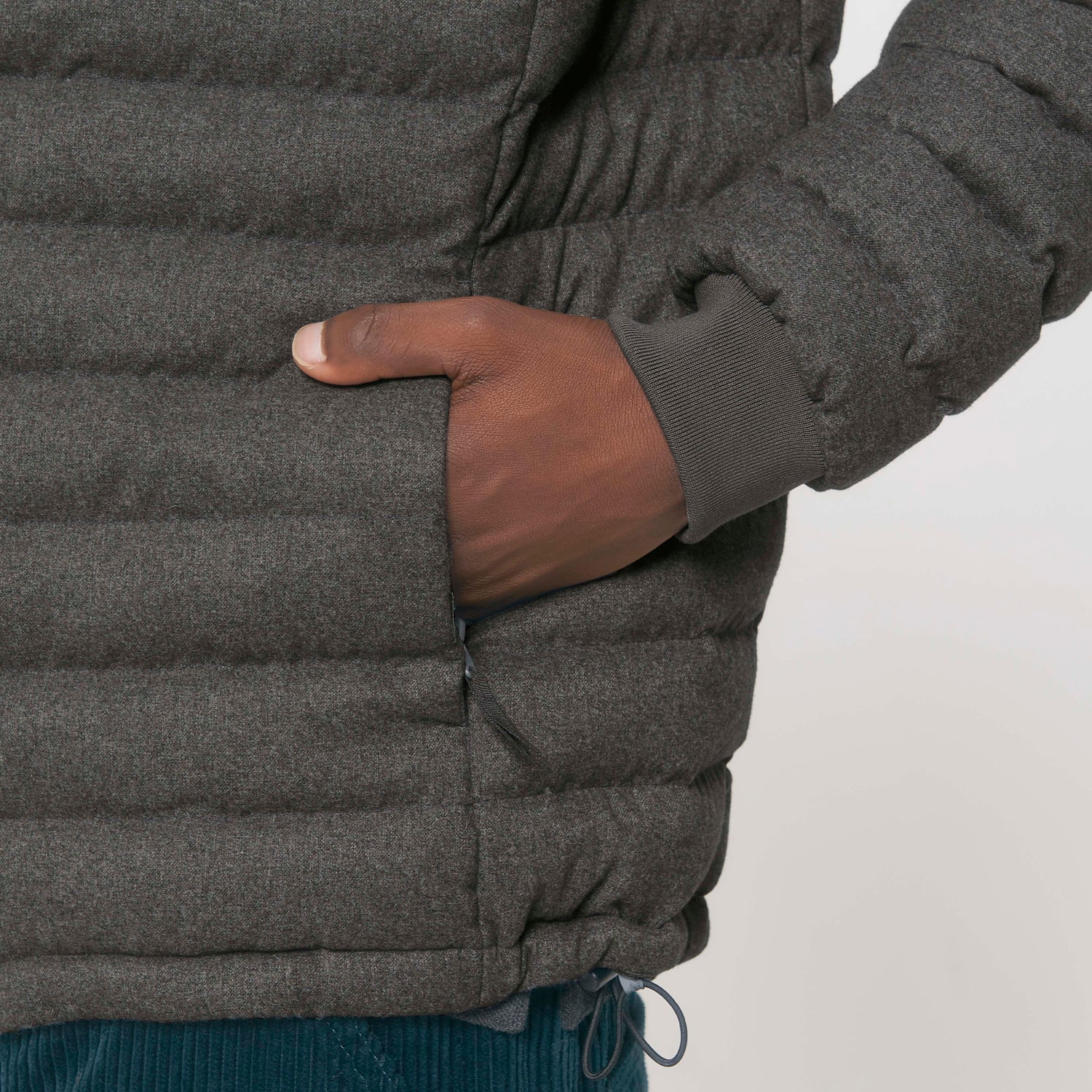 Detail of NEW WORLD GUARDIANS EARTH men’s padded jacket with wool-like texture, sustainable recycled polyester, 2 colors