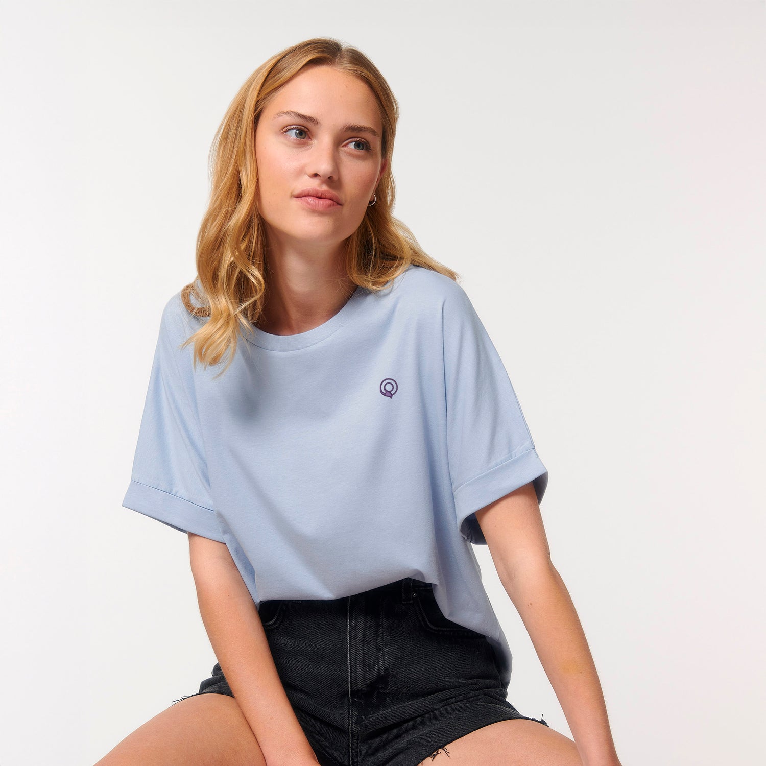 Light blue sustainable women’s t-shirt with relaxed silhouette, dolman sleeves, and rolled cuffs, organic cotton, 7 colors