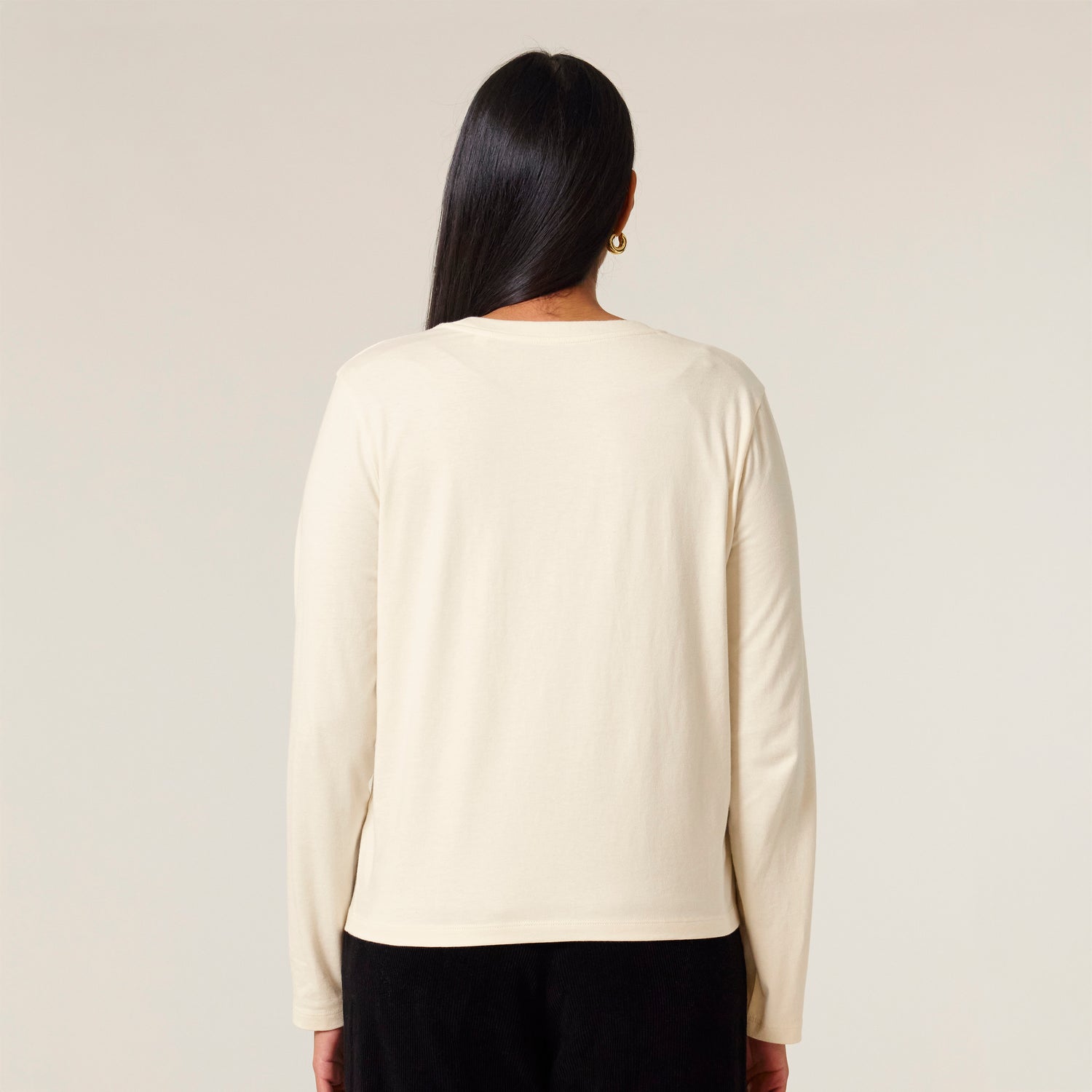Back view, beige sustainable women’s long-sleeve shirt with ribbed neckline and double stitching, eco-friendly organic cotton, 10 colors