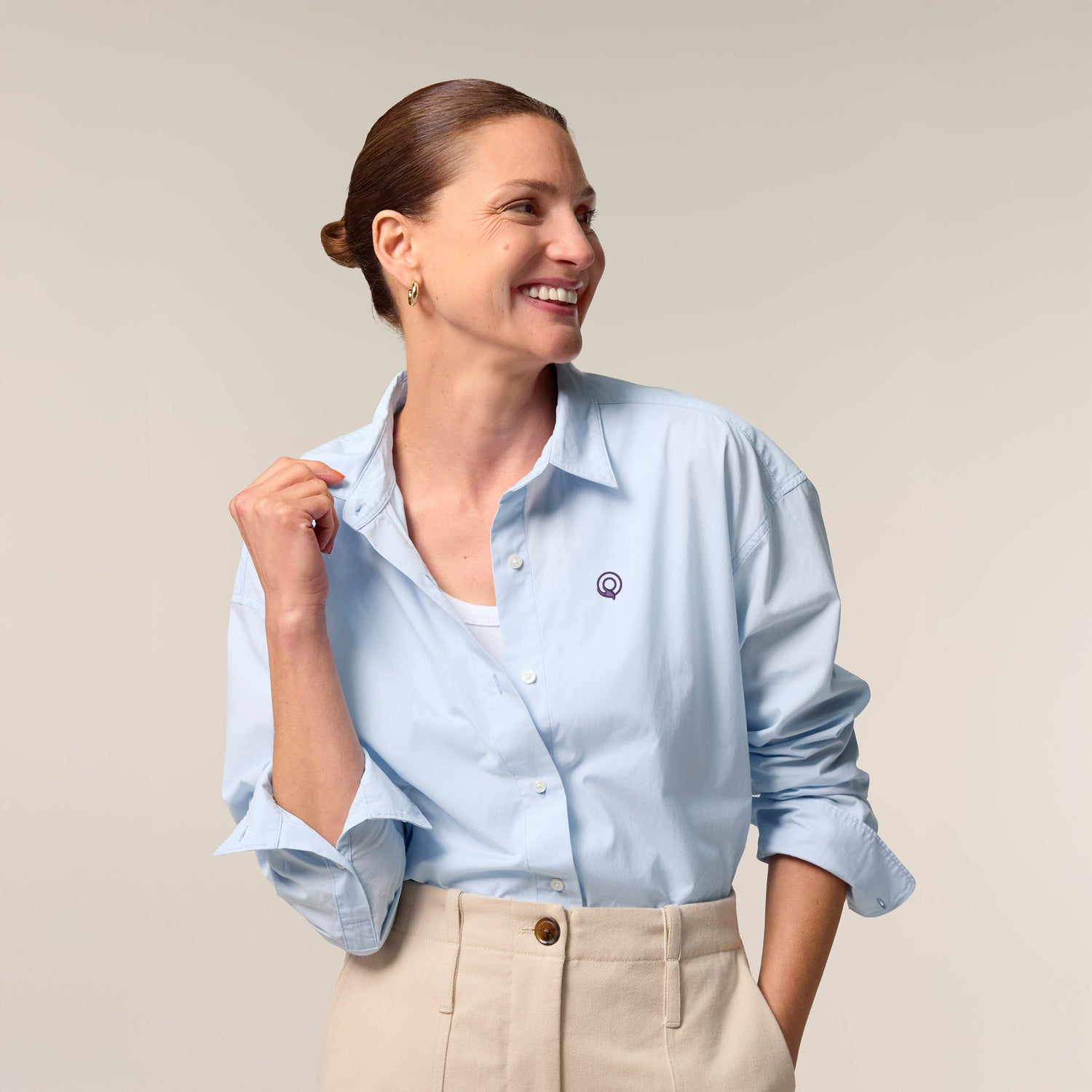 Female model wearing a summer blue shirt – sustainable and ethically made fashion by New World Guardians.