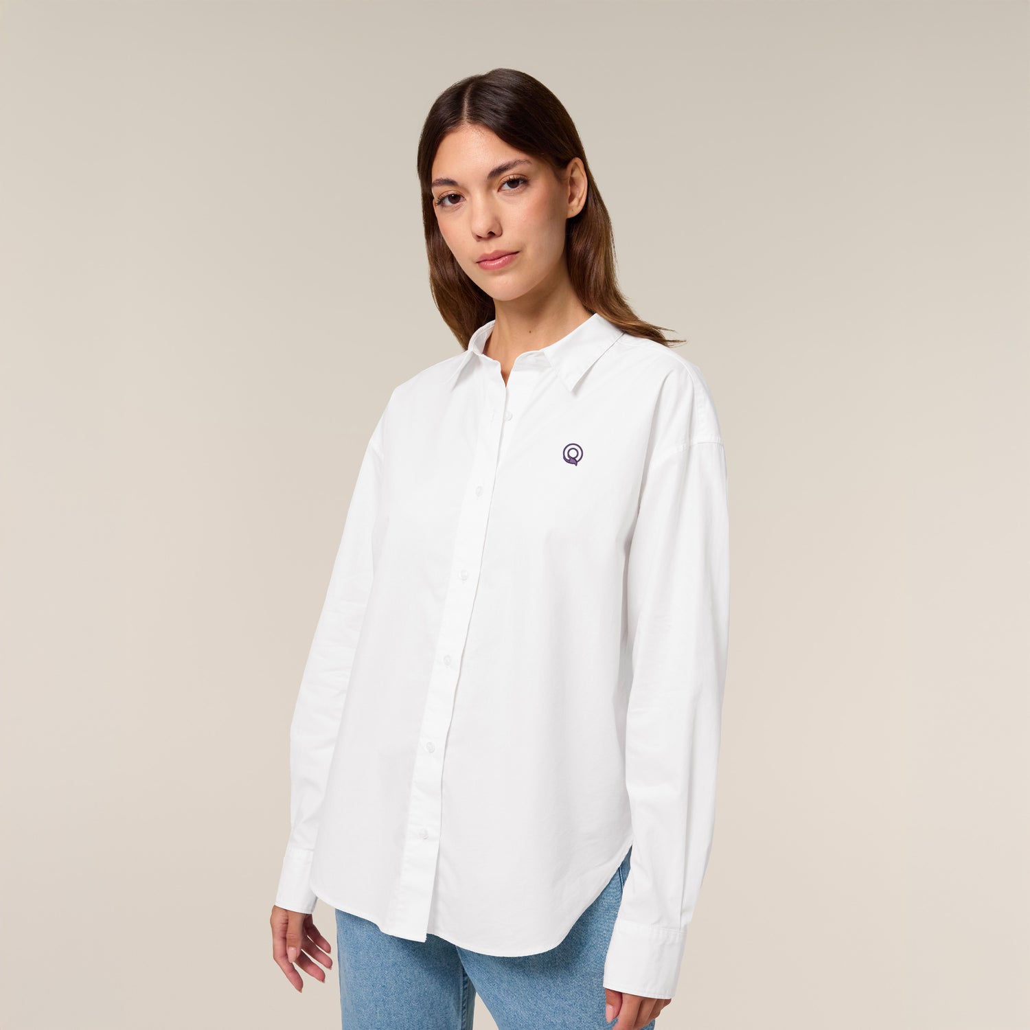 Female model wearing a white shirt – sustainable and ethically made fashion by New World Guardians.