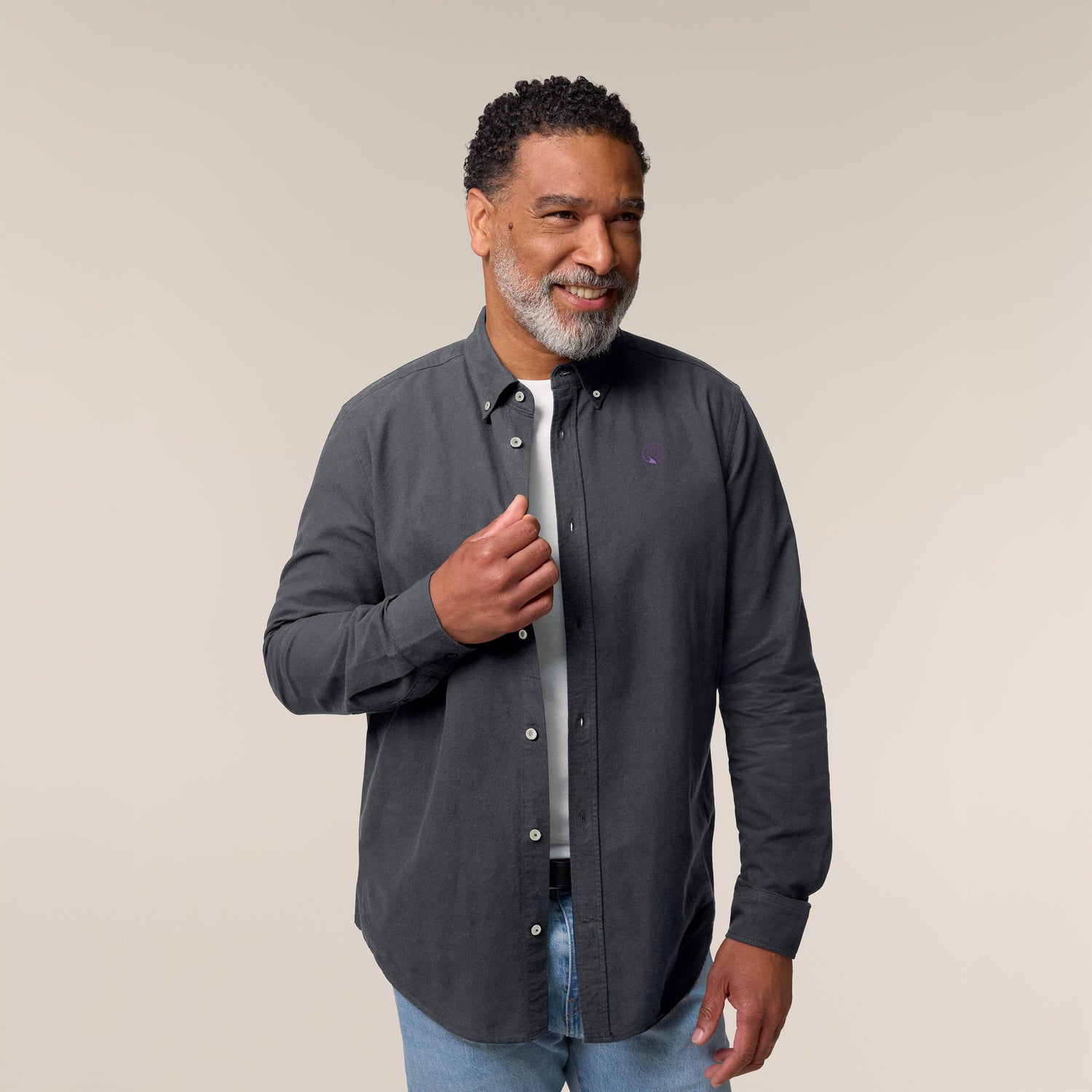 Male model wearing an anthracite Oxford shirt – sustainable and ethically made fashion by New World Guardians.