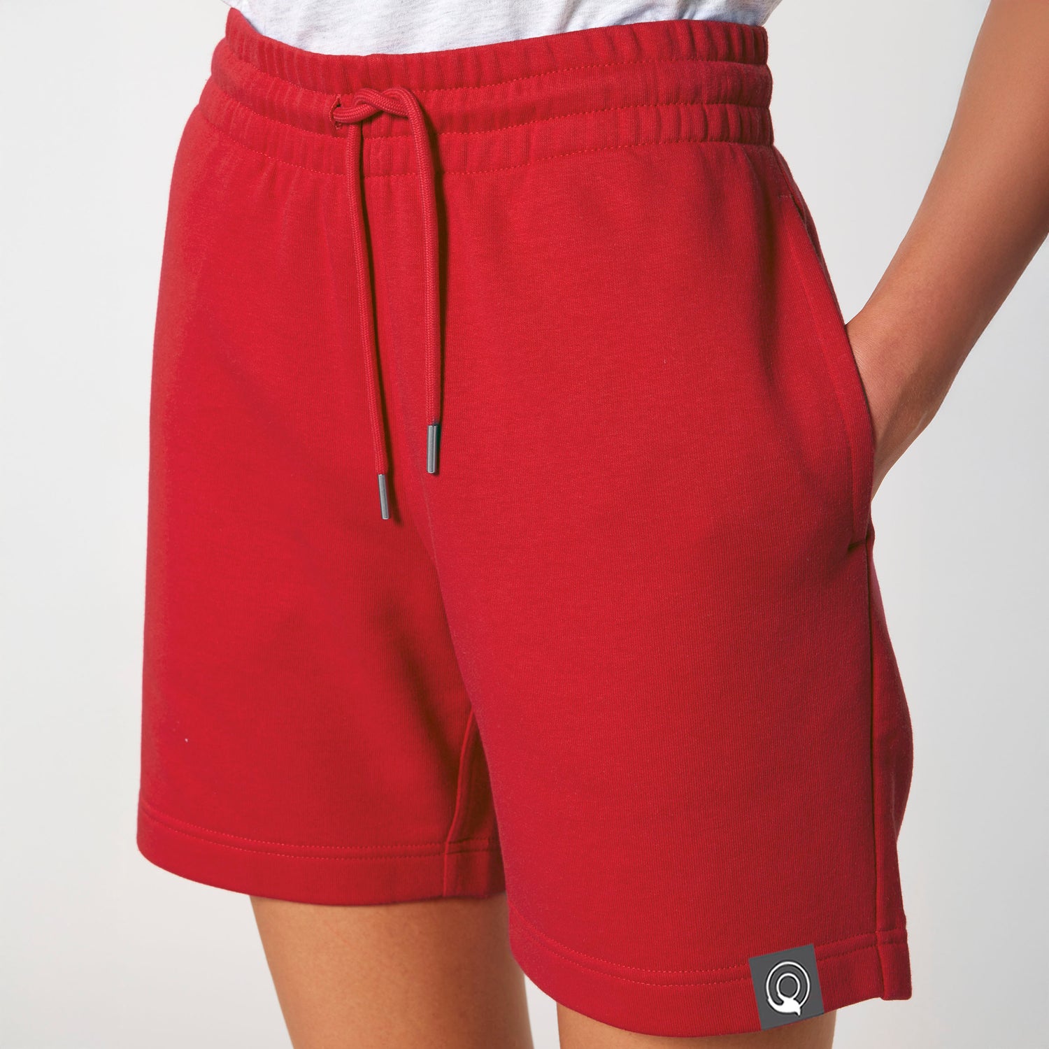 Sustainable jogger shorts in red with elastic waistband and drawstrings, NEW WORLD GUARDIANS IMPACT collection
