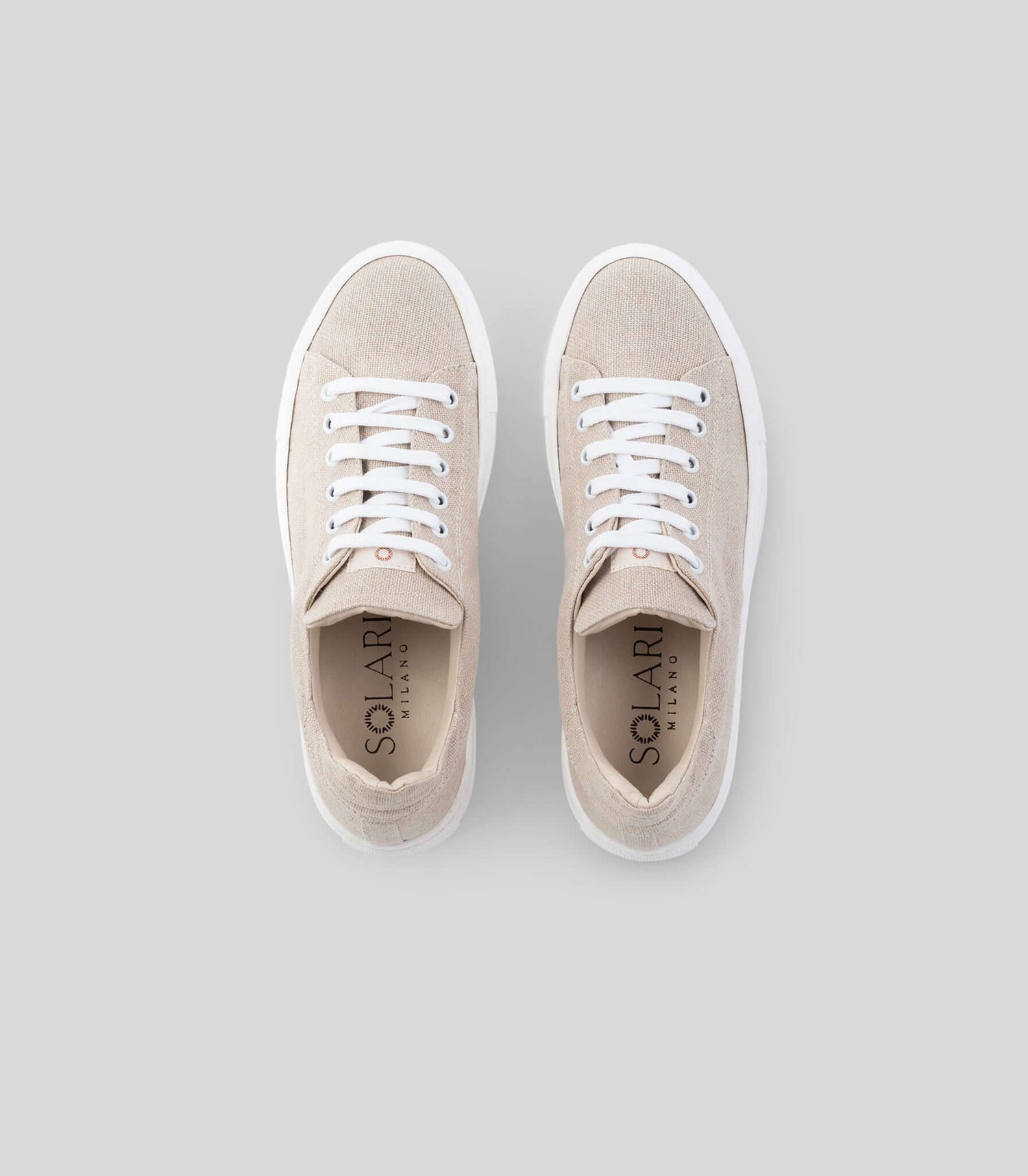 Vegan Hemp Sneaker V1 by Solari Milano featuring a beige hemp exterior and white laces, top view.