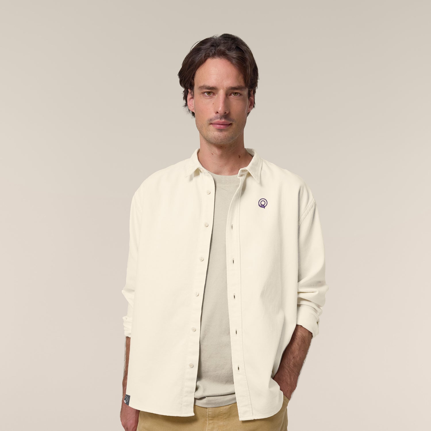 Male model wearing a natural raw worker shirt – sustainable and ethically made fashion by New World Guardians.