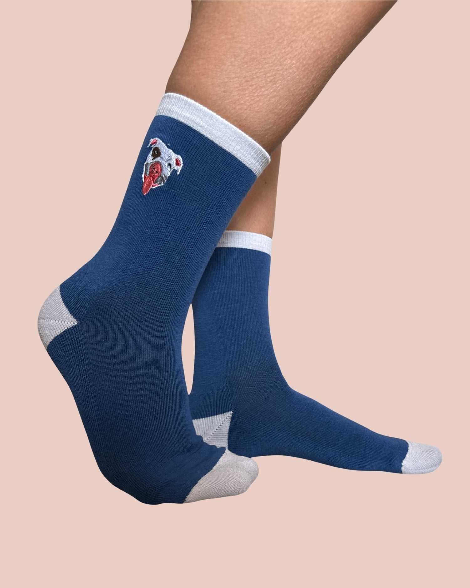 Blue socks with a logo on a beige background