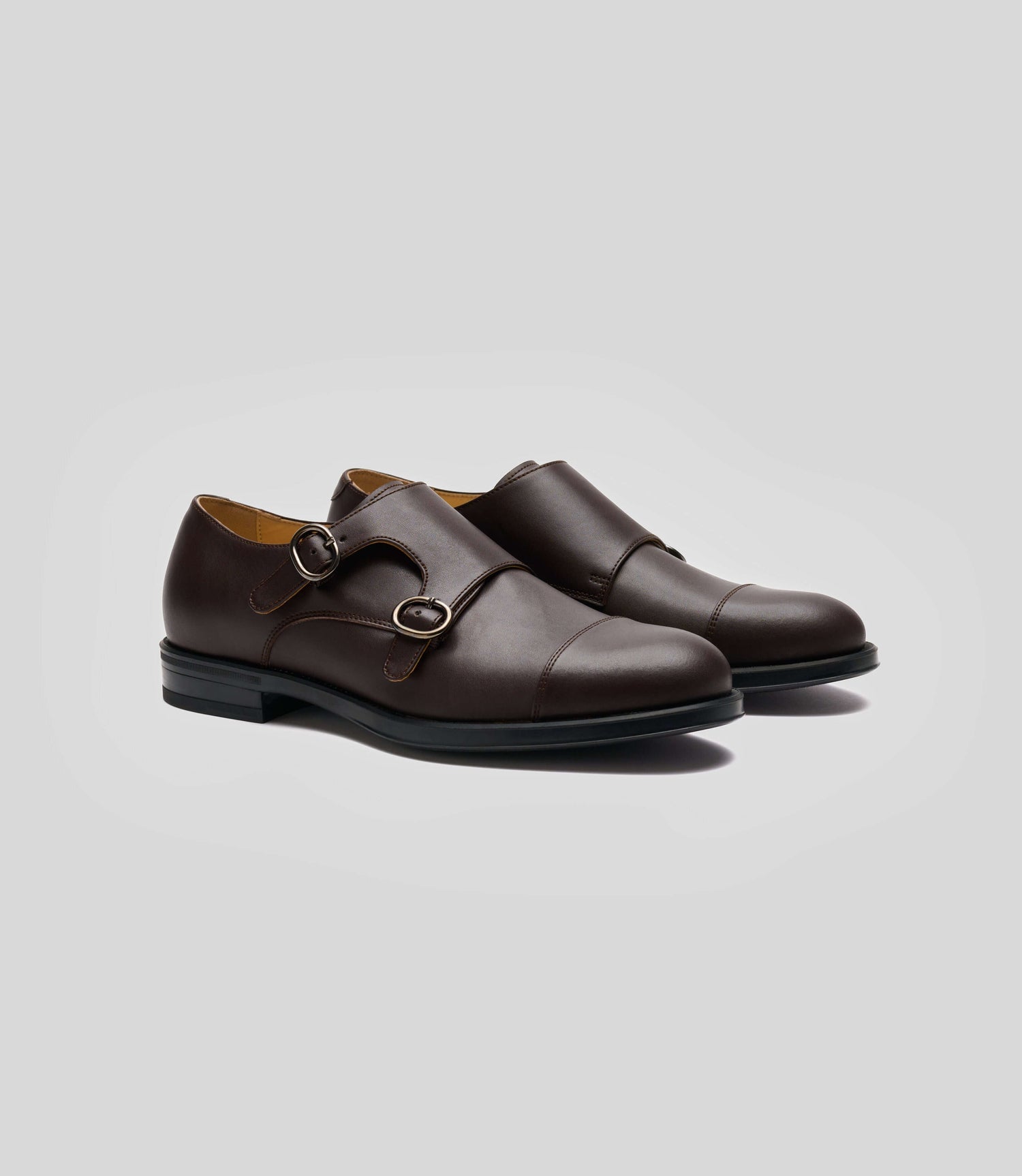 Vegan Monk Strap - Man, stylish brown shoes featuring double buckle design and Blake Construction for modern gentlemen.