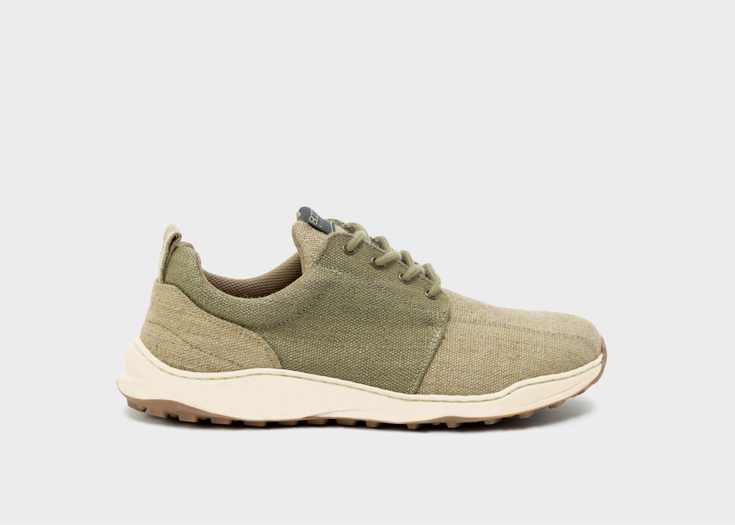 Green sneaker on a light gray background