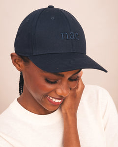 navy blue cap with 'nac' embroidered on it