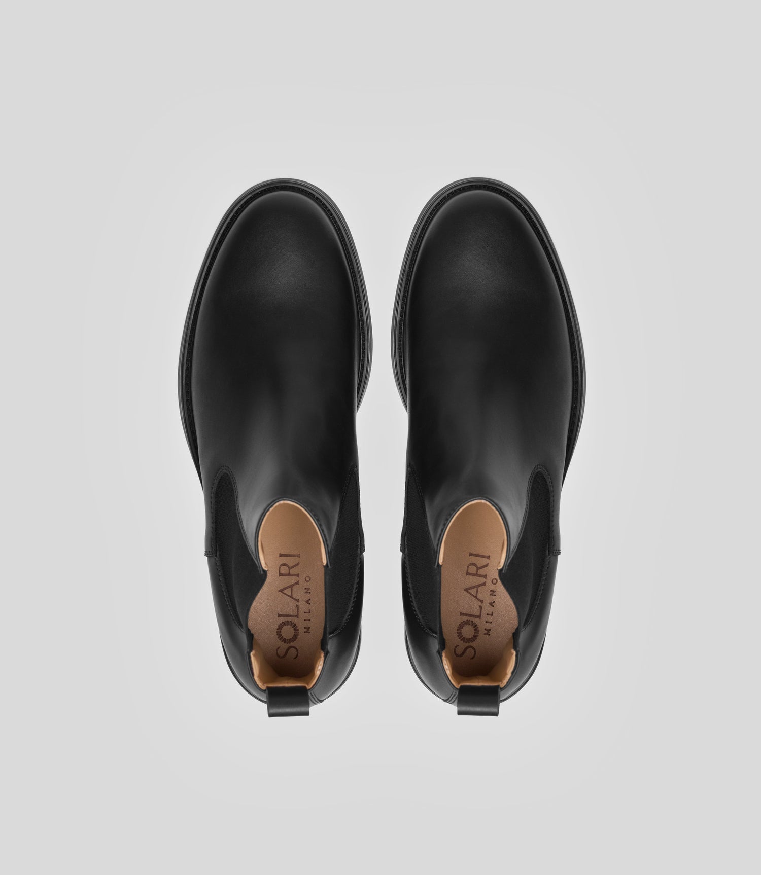 Vegan Chelsea Boot - Men, elegant black boots showing top view with a sleek design and stylish details.
