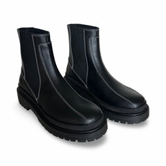 Pair of black vegan leather chelsea boots