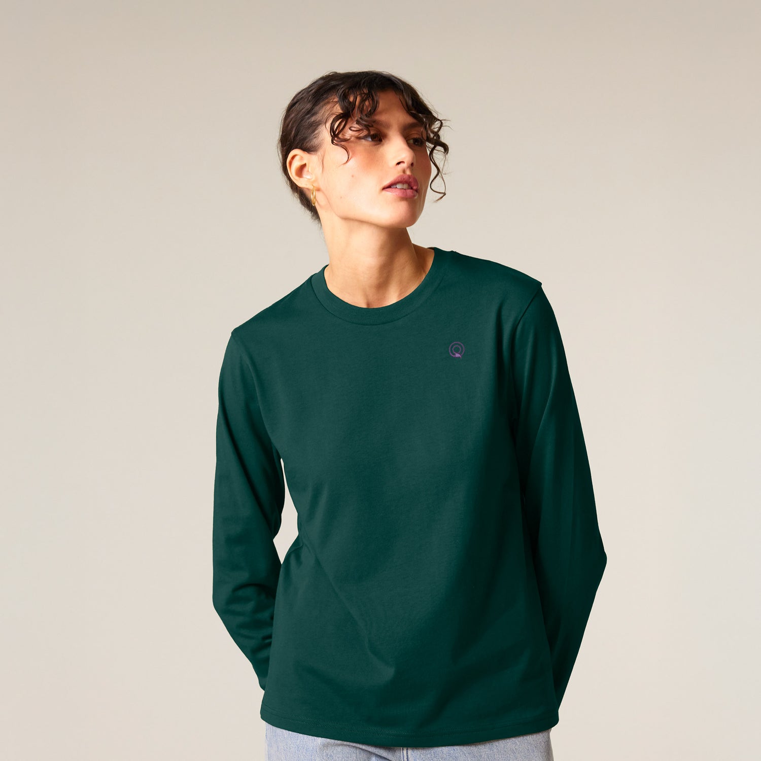 Female model wearing a green long sleeve shirt – sustainable and ethically made fashion by New World Guardians.