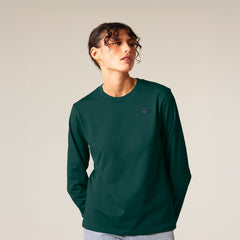 Female model wearing a green long sleeve shirt – sustainable and ethically made fashion by New World Guardians.