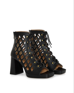 Black lace-up high-heeled shoes in vegan leather