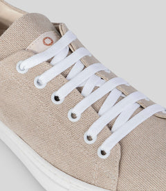 Close-up of Vegan Hemp Sneaker V1 featuring breathable hemp fabric and white laces.